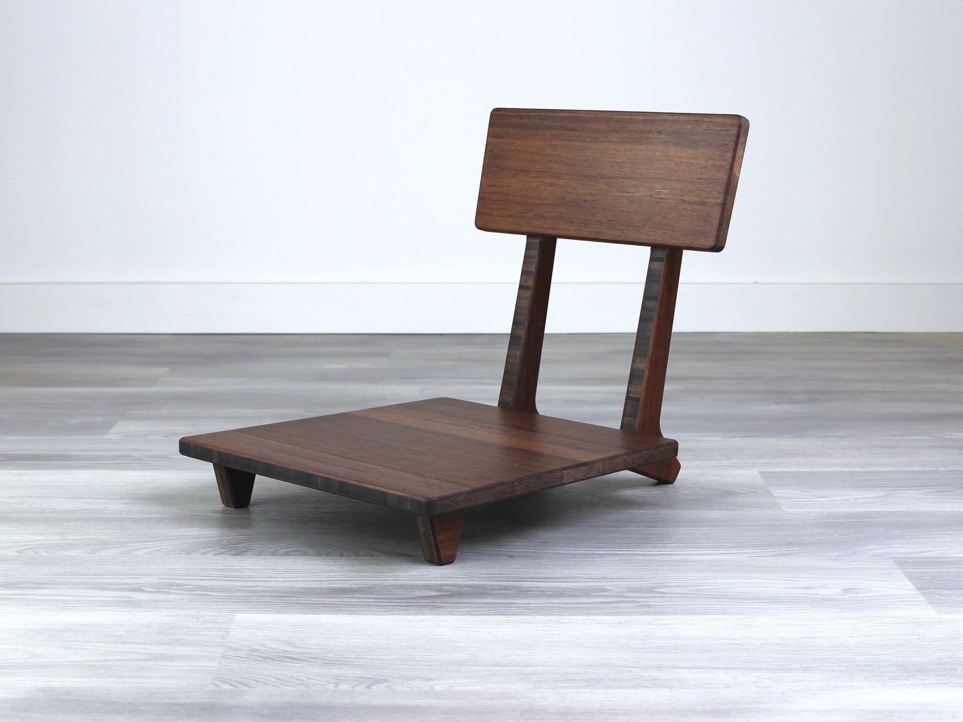 Sustainable walnut bamboo floor chair with ergonomic backrest, suitable for meditation, Kotatsu setups, and mid-century modern decor.
floor chair
chabudai
contemporary
low seating 
floor chair with back 
ergonomic 
posture support