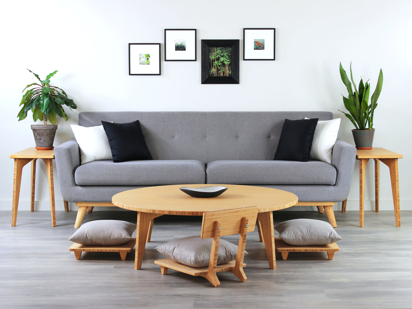 Large Circle Low Table with a natural bamboo finish and midcentury modern design. Three Floor Chair Comfort with grey pillows are set at the table. Small black pottery vessel placed on table top.
Japandi, minimalist, mid-century, Japanese inspired, modern, contemporary, clean lines, organic design, sustainable bamboo, renewable bamboo, solid bamboo, eco-friendly furniture, natural materials, natural-based finish