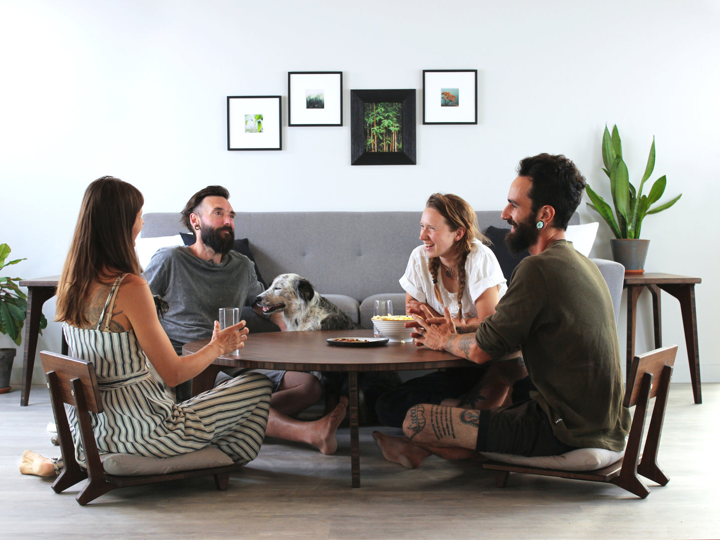 Large Circle Low Table with a walnut bamboo finish and midcentury modern design. People sitting in Floor Chair Comforts with a grey pillow are set at the table. Small black pottery vessel placed on table top.
Japandi, minimalist, mid-century, Japanese inspired, modern, contemporary, clean lines, organic design, sustainable bamboo, renewable bamboo, solid bamboo, eco-friendly furniture, natural materials, natural-based finish