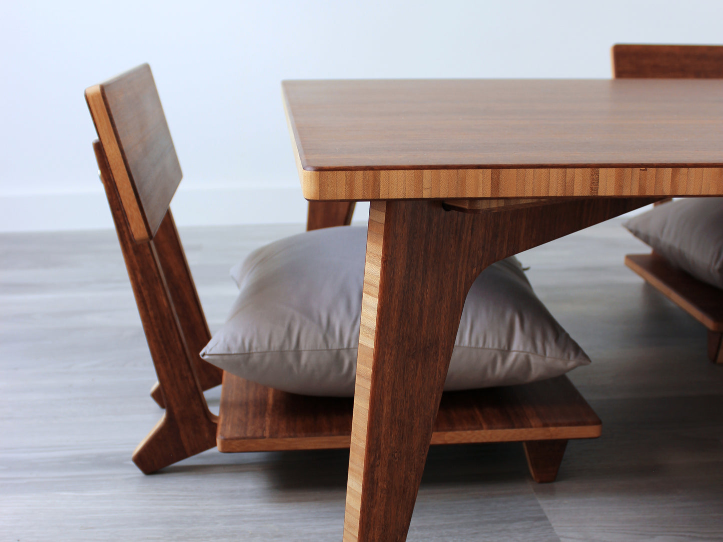 Large Rectangle Table Set - Chestnut. Set on a grey floor, against a white background. Floor Chair Comfort set underneath. A black pottery vessels on table top.
low table, coffee table, dining table, floor desk, floor chair, floor seating, low dining table, chabudai, tatami, kotatsu, minimalist, minimalist table,
modern, japanese low table, japanese table, kotatsu, large coffee table,
large dining table