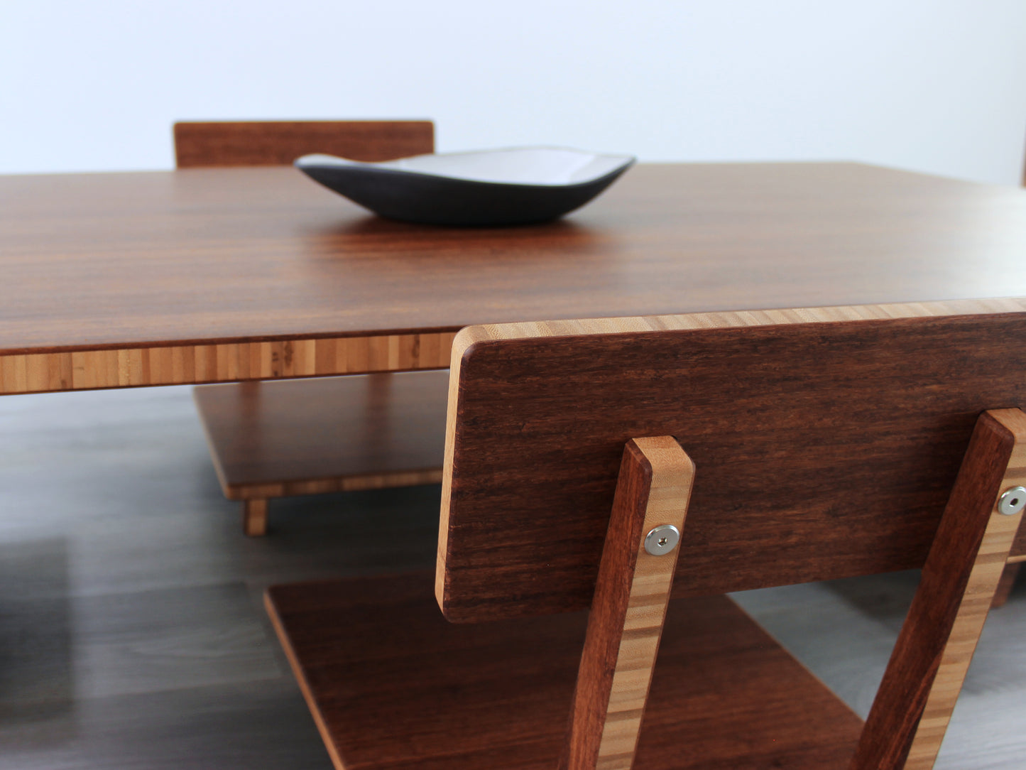 Large Rectangle Table Set - Chestnut. Set on a grey floor, against a white background. Two Floor Chair Posture set underneath. A black pottery vessels on table top.
low table, coffee table, dining table, floor desk, floor chair, floor seating, low dining table, chabudai, tatami, kotatsu, minimalist, minimalist table,
modern, japanese low table, japanese table, kotatsu, large coffee table,
large dining table