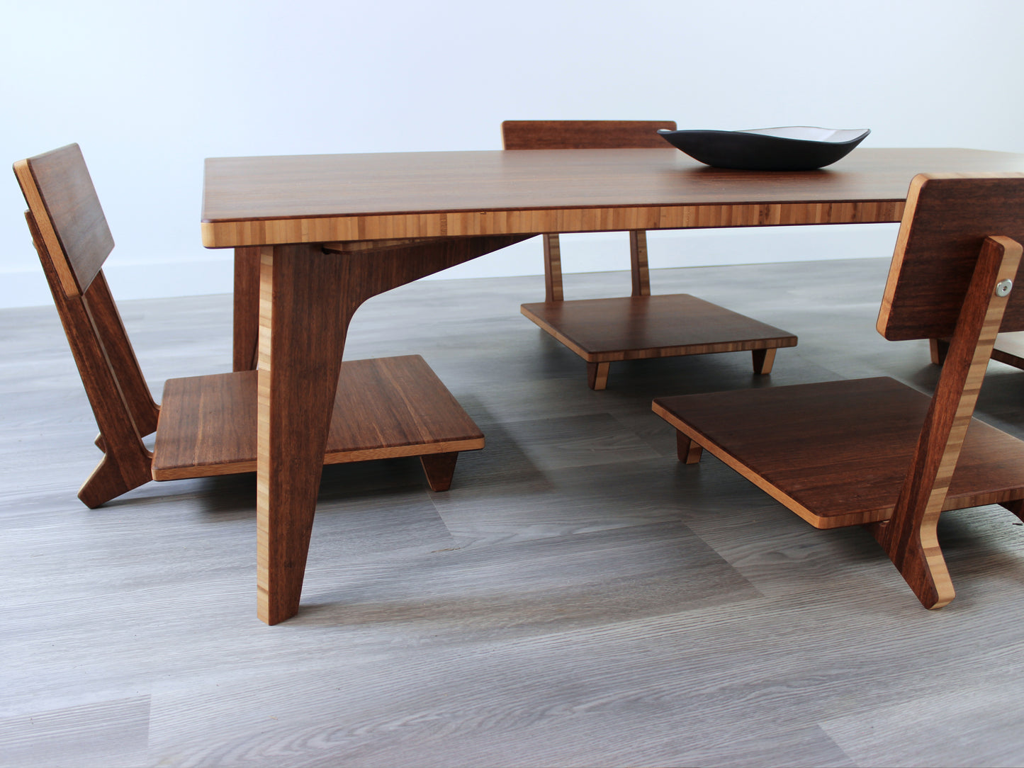 Large Rectangle Table Set - Chestnut. Set on a grey floor, against a white background. Four Floor Chair Comfort set underneath. A black pottery vessels on table top.
low table, coffee table, dining table, floor desk, floor chair, floor seating, low dining table, chabudai, tatami, kotatsu, minimalist, minimalist table,
modern, japanese low table, japanese table, kotatsu, large coffee table,
large dining table