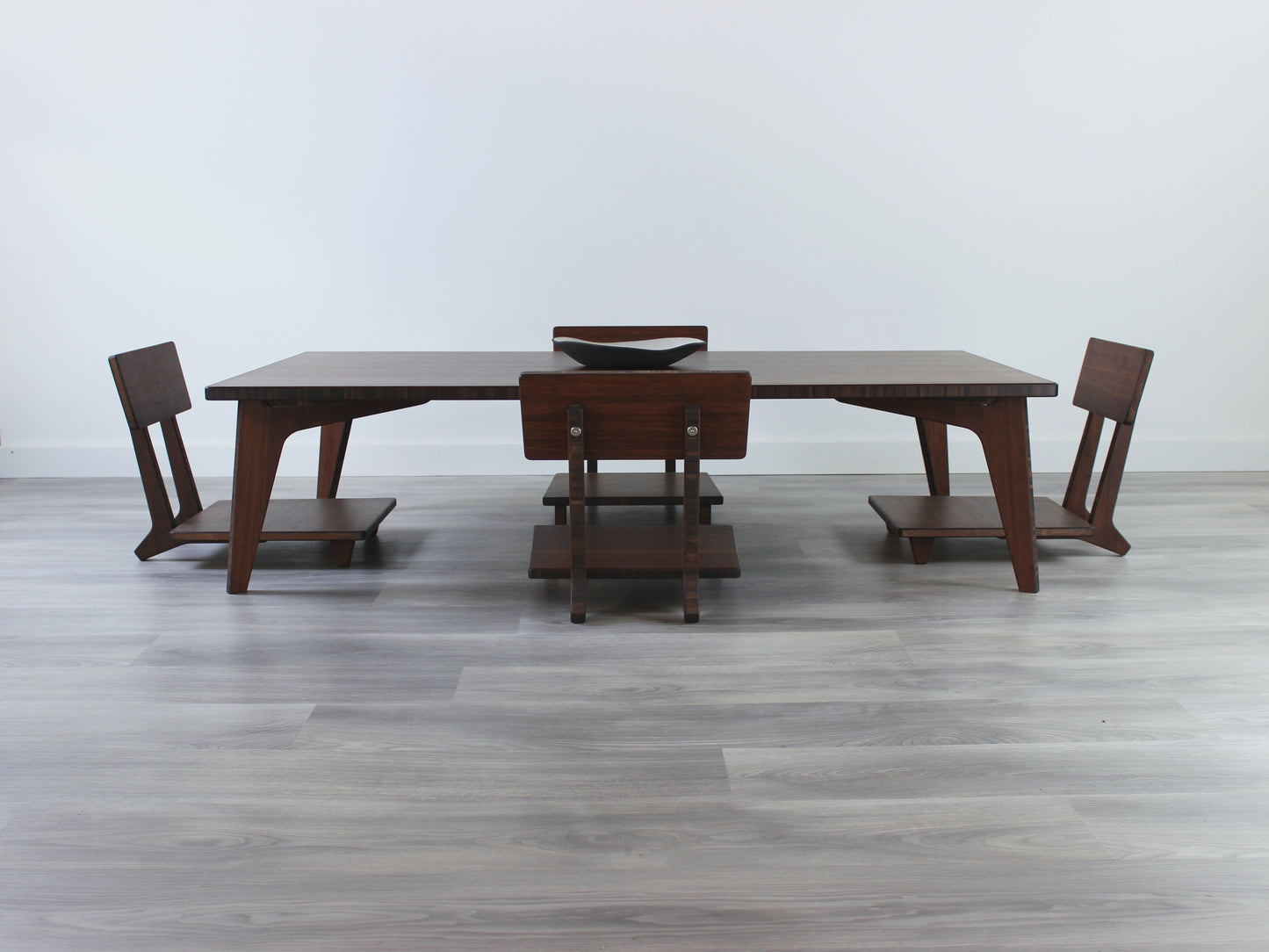Large Rectangle Table Set - Walnut. Set on a grey floor, against a white background. Four Floor Chair Comfort set underneath. A black pottery vessel on table top.
low table, coffee table, dining table, floor desk, floor chair, floor seating, low dining table, chabudai, tatami, kotatsu, minimalist, minimalist table,
modern, japanese low table, japanese table, kotatsu, large coffee table,
large dining table