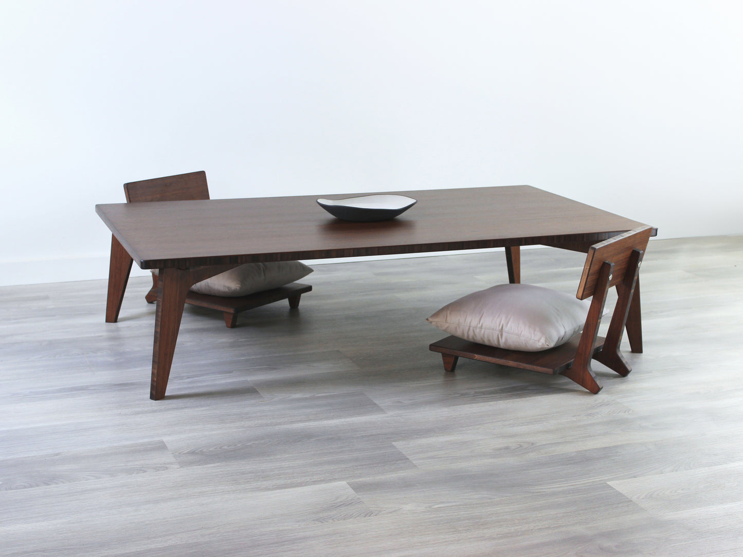 Large Rectangle Table Set - Walnut. Set on a grey floor, against a white background. Two Floor Chair Comfort set underneath. A black pottery vessel on table top.
low table, coffee table, dining table, floor desk, floor chair, floor seating, low dining table, chabudai, tatami, kotatsu, minimalist, minimalist table,
modern, japanese low table, japanese table, kotatsu, large coffee table,
large dining table