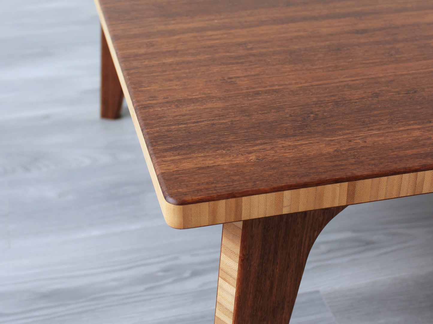 A large rectangular low table made of bamboo with a chestnut finish, placed on a grey floor.
japanese furniture
japanese low table
low coffee table
low dining table
low table
mid century
minimalist
minimalist table
modern
