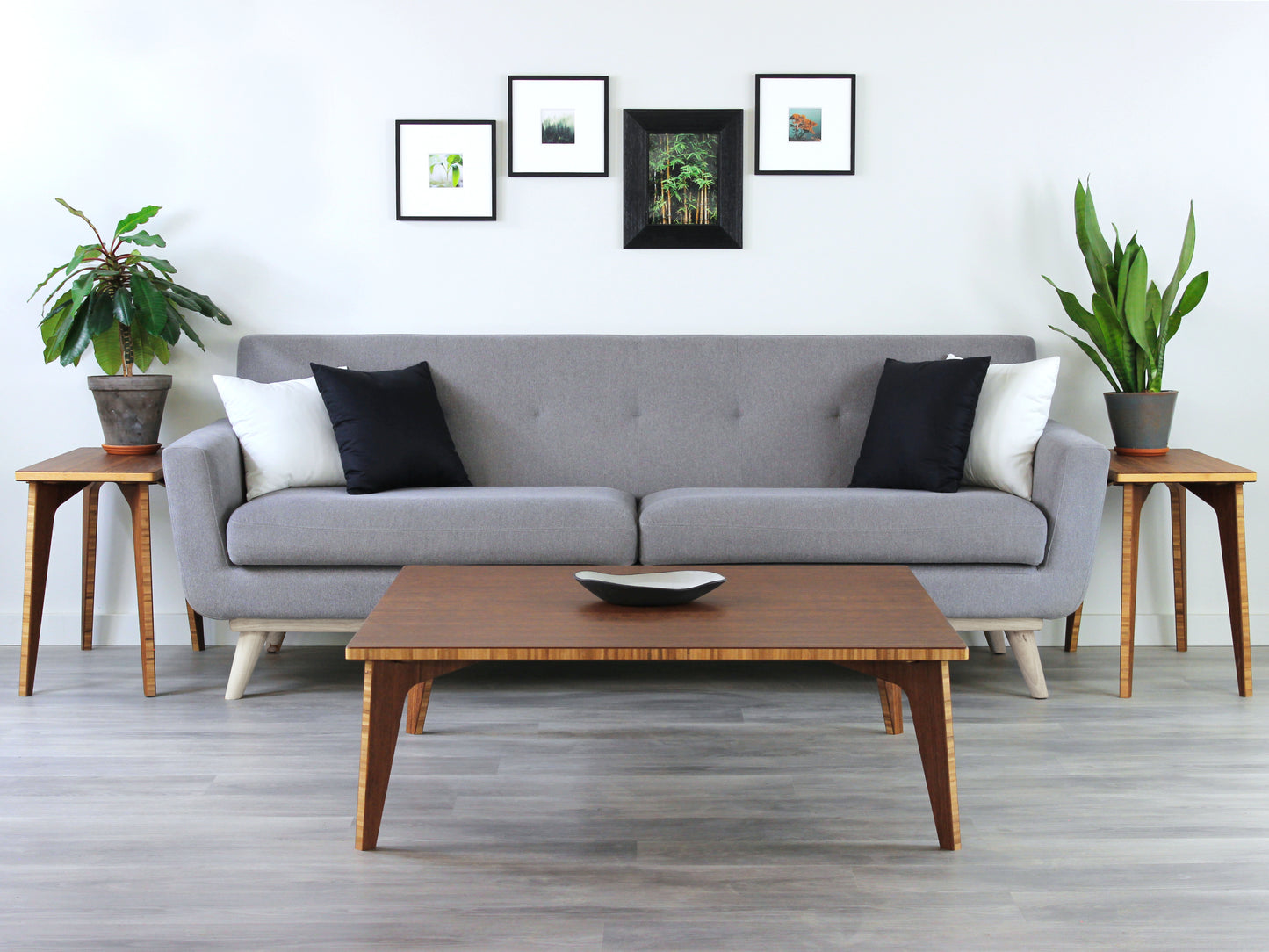 Large square floor table in bamboo with a chestnut color finish, featuring a Japandi style design, set on a grey floor with a white background. Set in a living room area, a grey couch and side tables with houseplants. A small black pottery vessel is placed on the table top.
Square low table
japanese furniture
japanese low table
low coffee table
low dining table
low table
mid century
minimalist
minimalist table
modern
chabudai