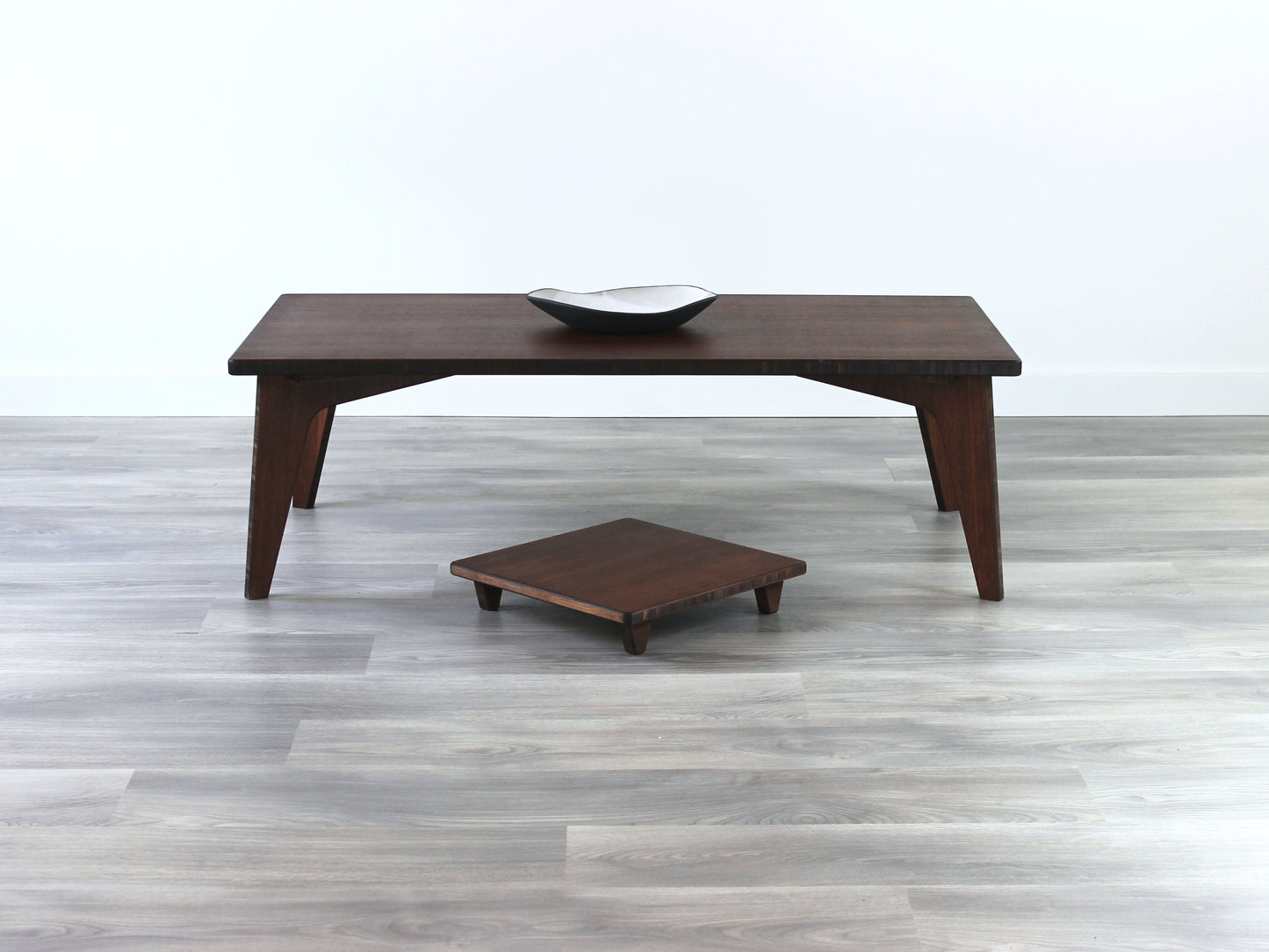 Small Rectangle Table Set - Walnut low table with Floor Chair Posture set underneath. Set on a grey floor, against a white background. A small black pottery vessel is on the table top.
low table, coffee table, dining table, floor desk, floor chair, floor seating, low dining table, chabudai, tatami, kotatsu, minimalist, minimalist table,
modern