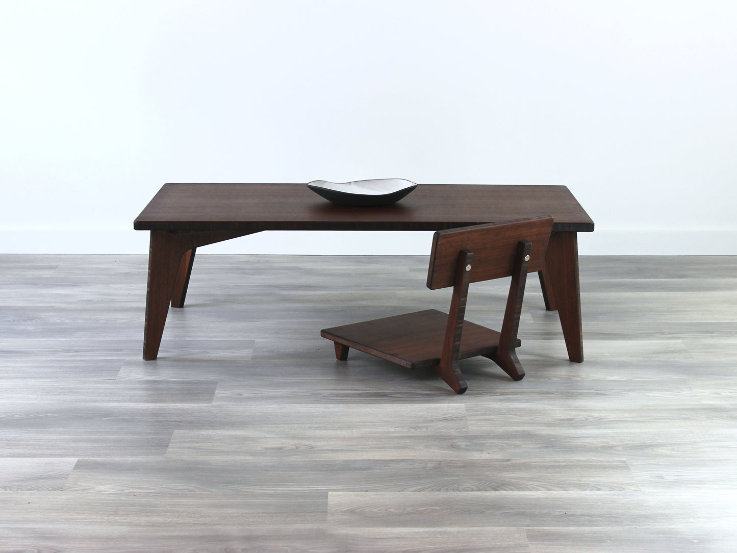 Small Rectangle Table Set - Walnut low table with Floor Chair Comfort set underneath. Set on a grey floor, against a white background. A small black pottery vessel is on the table top.
low table, coffee table, dining table, floor desk, floor chair, floor seating, low dining table, chabudai, tatami, kotatsu, minimalist, minimalist table,
modern