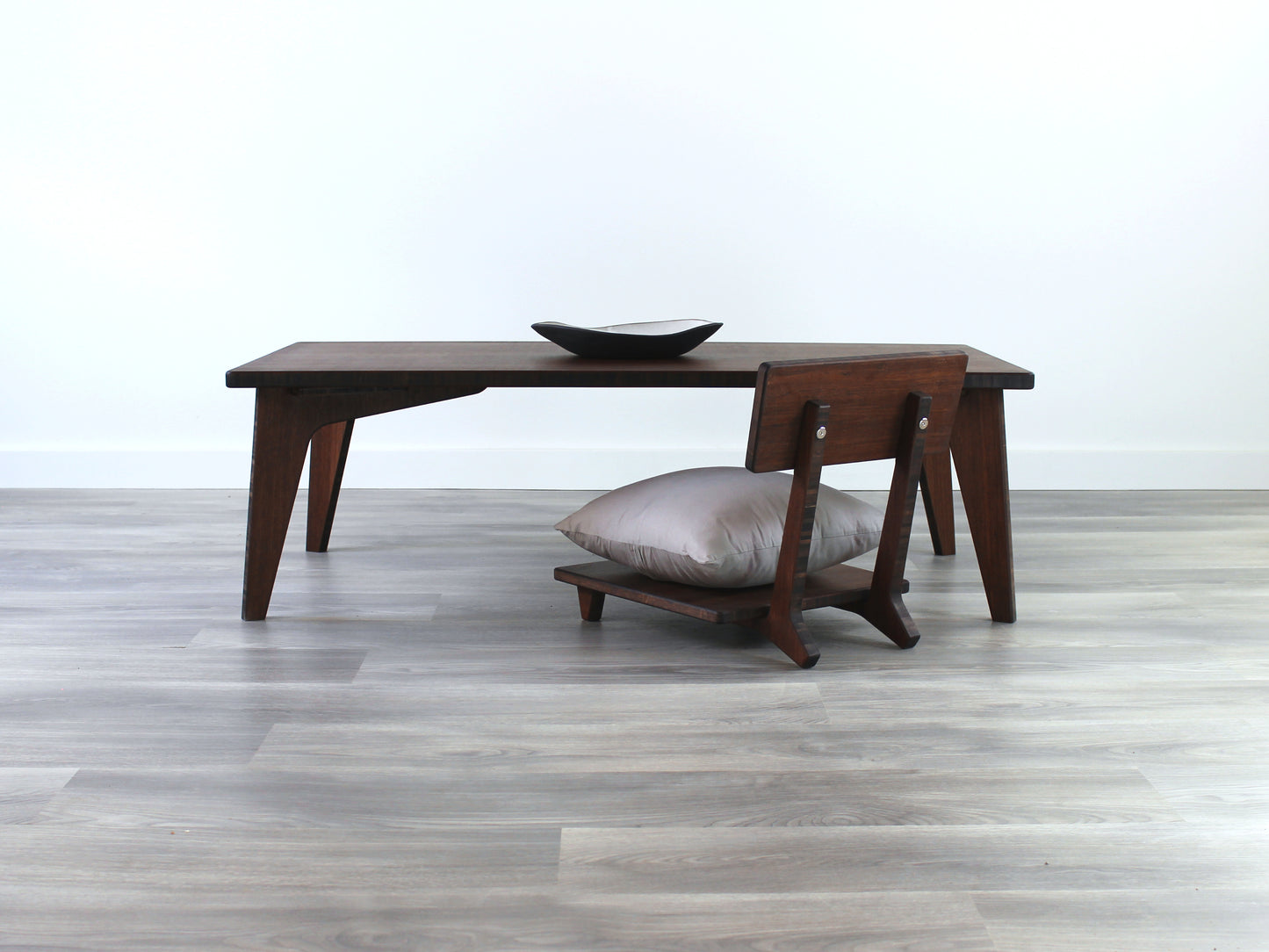 Small Rectangle Table Set - Walnut low table with Floor Chair Comfort set under with grey pillow. Set on a grey floor, against a white background. A small black pottery vessel is on the table top.
low table, coffee table, dining table, floor desk, floor chair, floor seating, low dining table, chabudai, tatami, kotatsu, minimalist, minimalist table,
modern