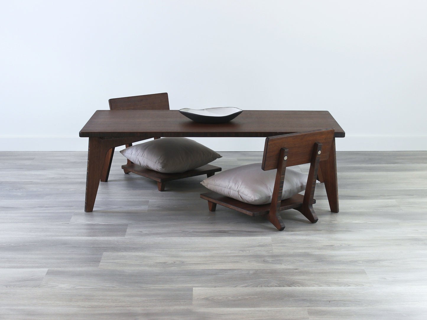 Small Rectangle Table Set - Walnut, low table with Floor Chair Comfort set under with grey pillow. Set on a grey floor, against a white background. A small black pottery vessel is on the table top.
low table, coffee table, dining table, floor desk, floor chair, floor seating, low dining table, chabudai, tatami, kotatsu, minimalist, minimalist table,
modern