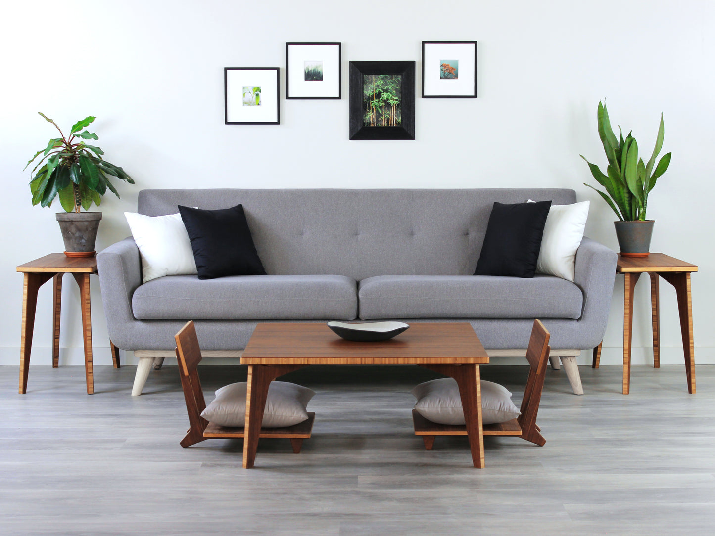 Small Square Table Set in chestnut finish. Two Floor Chair Comfort are placed below. A small black pottery vessel is placed on top of the table. Set in a living room with a grey couch, side tables and house plants.
sustainable bamboo, renewable bamboo, solid bamboo, eco-friendly furniture, zero-waste, carbon neutral, natural materials, natural-based finish, repairable furniture