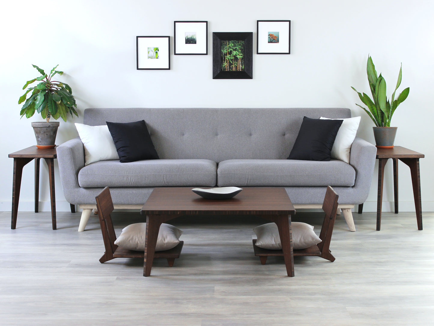 Small Square Table Set in walnut finish. Two Floor Chair Comfort with grey pillows are placed below. A small black pottery vessel is placed on top of the table. Living room setting with a grey couch, side tables, and house plants.
sustainable bamboo, renewable bamboo, solid bamboo, eco-friendly furniture, zero-waste, carbon neutral, natural materials, natural-based finish, repairable furniture