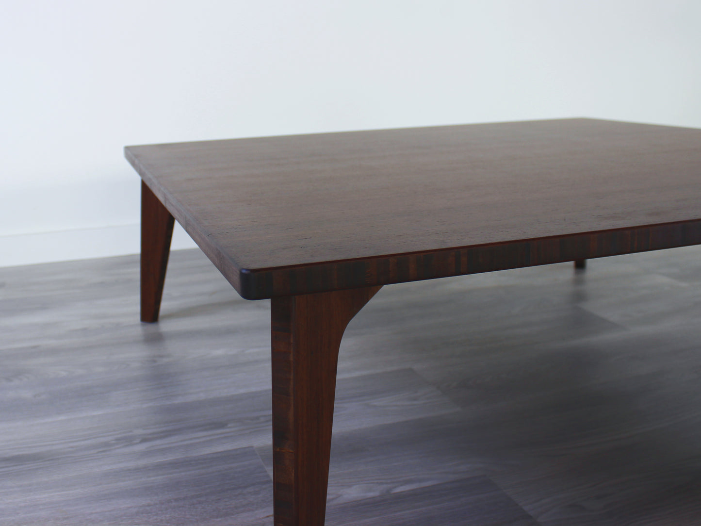 Small Square Table Set in walnut finish. Two Floor Chair Posture with grey pillows are placed below.
sustainable bamboo, renewable bamboo, solid bamboo, eco-friendly furniture, zero-waste, carbon neutral, natural materials, natural-based finish, repairable furniture