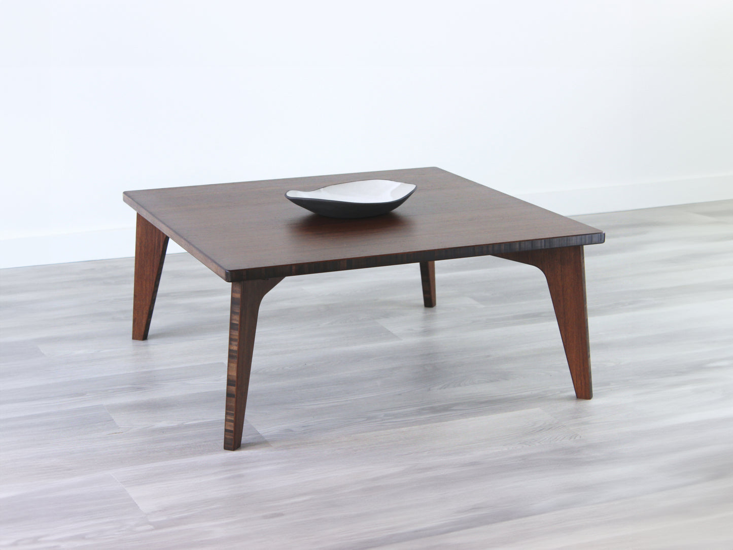 A small square, walnut bamboo table with visible wood grain, placed on a grey floor.
mid century modern low table
midcentury modern coffee table
floor table
japan coffee table
japan furniture
japan table
small coffee table
bamboo low table