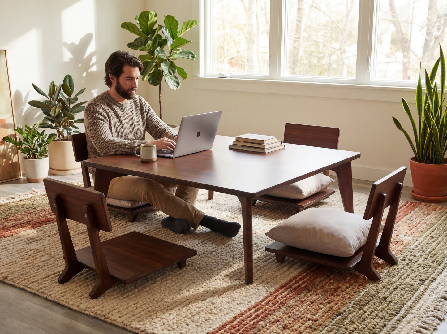 Man sitting at a bamboo table with a laptop in a bright room with plants and books.
low table, coffee table, dining table, floor desk, floor chair, floor seating, low dining table, chabudai, tatami, kotatsu, minimalist, minimalist table,
modern, japanese low table, japanese table, kotatsu, large coffee table,
large dining table