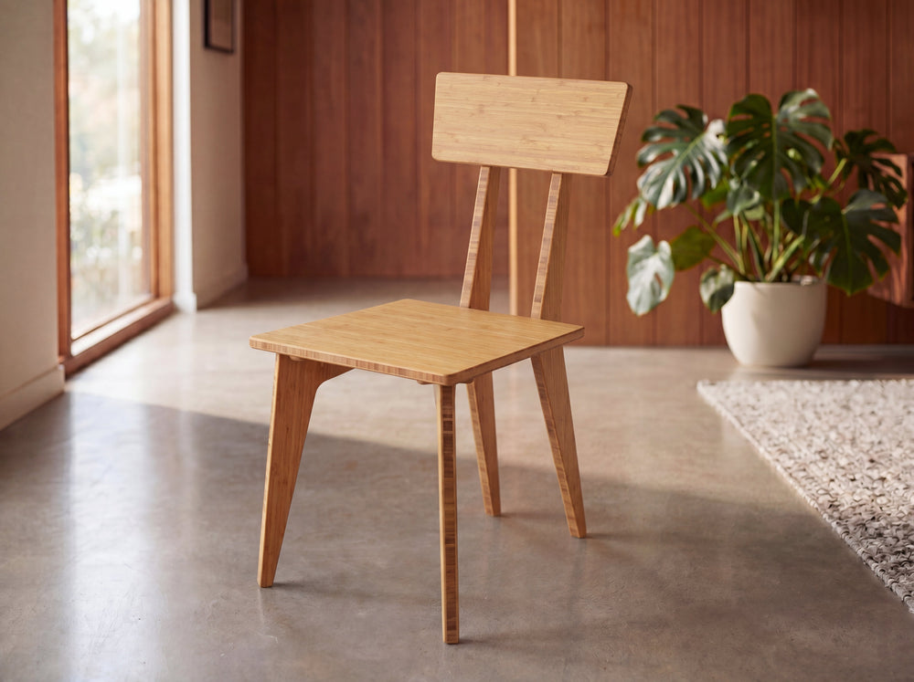 Bamboo dining chair in a bright room with plants and large windows.