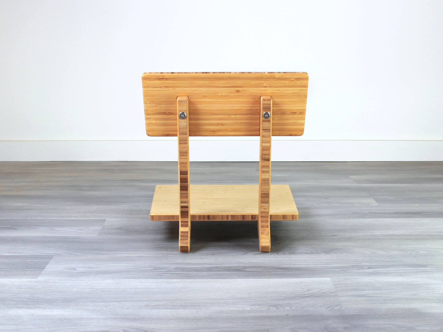 Sustainable bamboo floor chair featuring a low-profile design and sturdy backrest, perfect for meditation and Japanese-style low tables. Placed on grey floor and white back wall.

floor chair
chabudai
contemporary
low seating 
floor chair with back 
ergonomic 