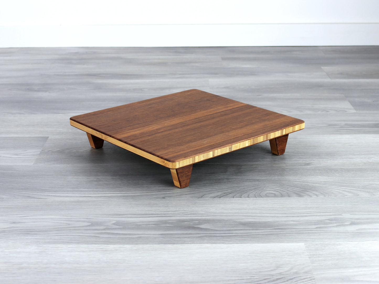 Chestnut Floor Chair Posture, placed on a grey floor and a white wall background. 

Meditation Chair 
Japanese Tea Table 
Kotatsu
low chair
posture support 
ergonomic 
minimilist 