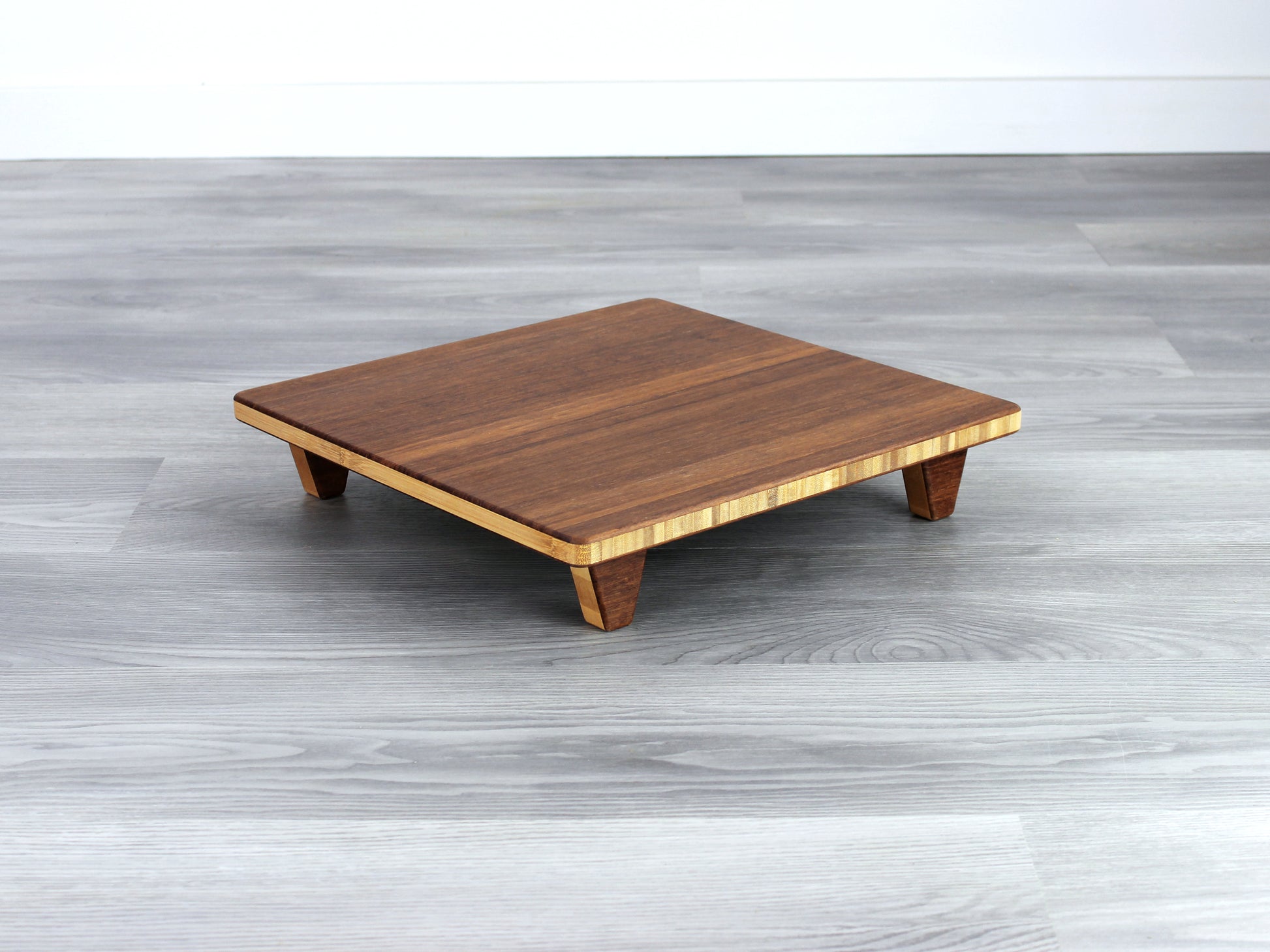 Chestnut Floor Chair Posture, placed on a grey floor and a white wall background. 

Meditation Chair 
Japanese Tea Table 
Kotatsu
low chair
posture support 
ergonomic 
minimilist 