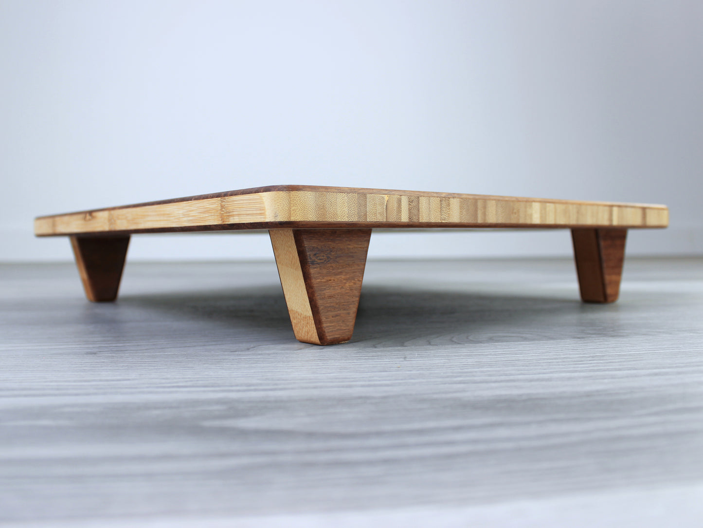 Chestnut Floor Chair Posture, placed on a grey floor and a white wall background. 

Meditation Chair 
Japanese Tea Table 
Kotatsu
low chair
posture support 
ergonomic 
minimilist