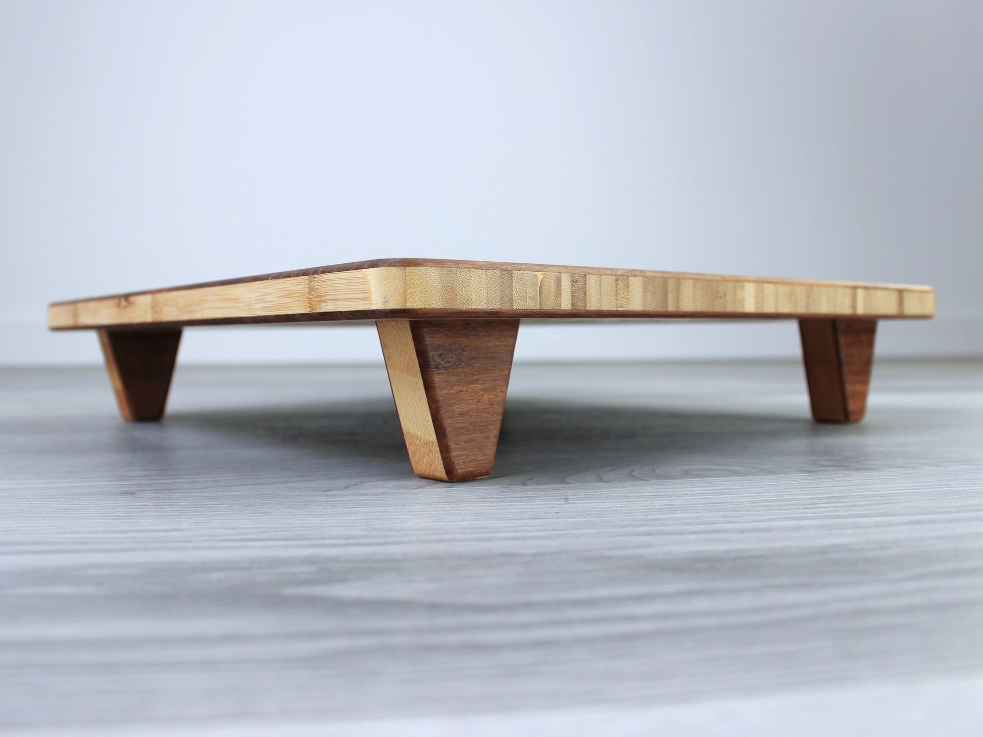 Chestnut Floor Chair Posture, placed on a grey floor and a white wall background. 

Meditation Chair 
Japanese Tea Table 
Kotatsu
low chair
posture support 
ergonomic 
minimilist