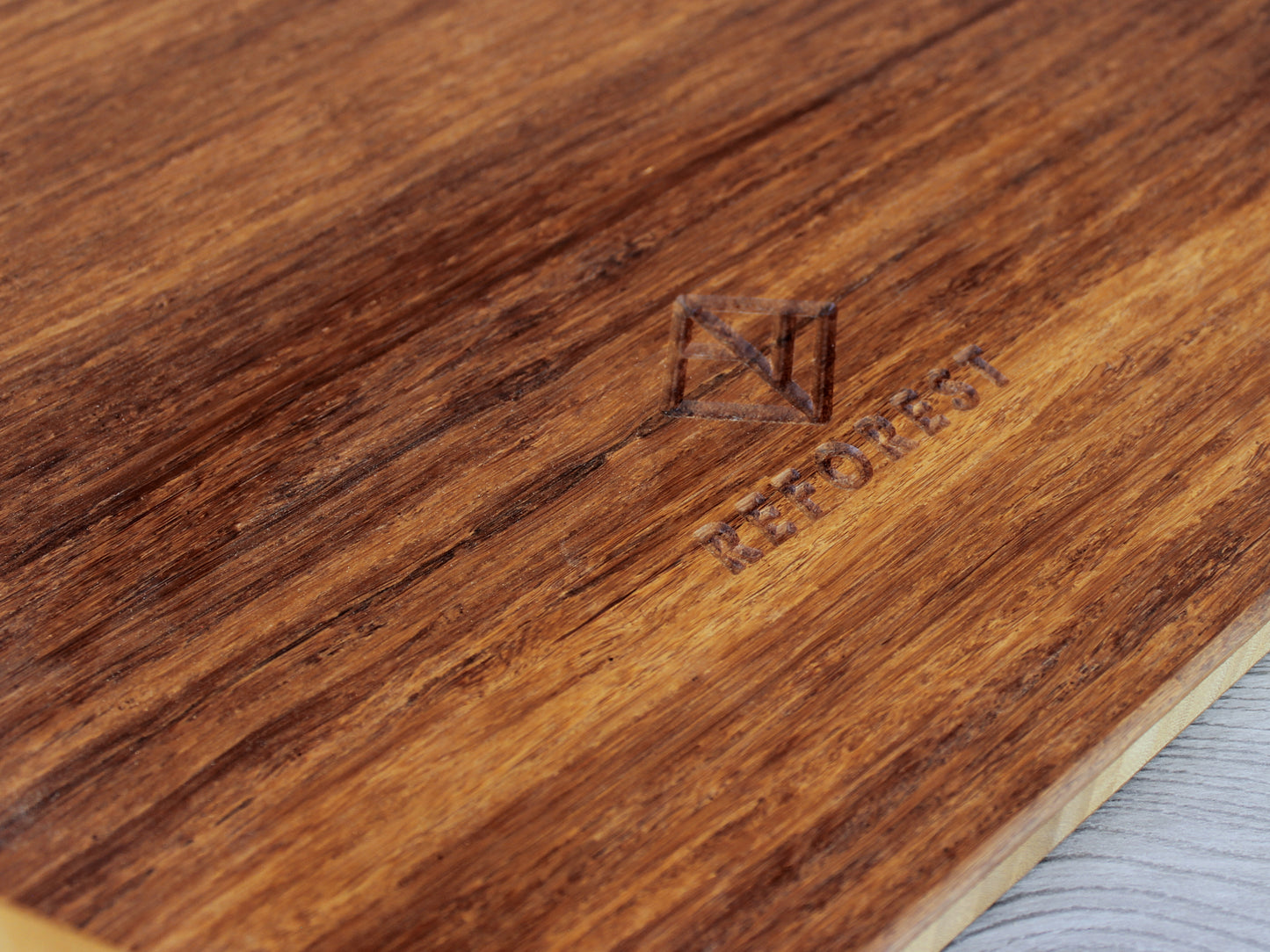 Chestnut Floor Chair Posture, placed on a grey floor and a white wall background. Close up of grain and Reforest logo.

Meditation Chair 
Japanese Tea Table 
Kotatsu
low chair
posture support 
ergonomic 
minimilist