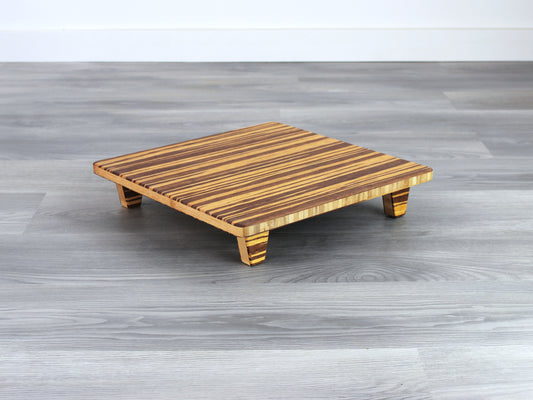 Tiger Floor Chair Posture, placed on a grey floor and a white wall background. 

Meditation Chair 
Japanese Tea Table 
Kotatsu
low chair
posture support 
ergonomic 
minimilist