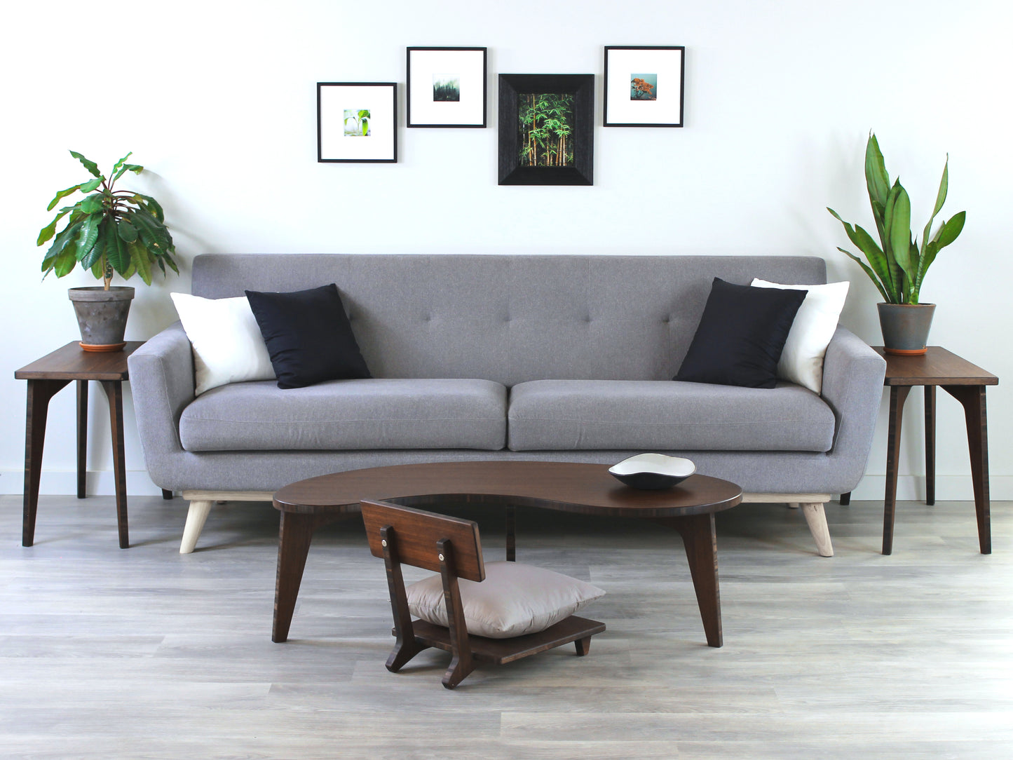 A Kidney LOW Table Set in walnut bamboo, featuring a small black and white pottery vessel placed on top. Floor Chair Comfort with a grey pillow set underneath. Placed on a Grey flooring with a white background. 

mid century modern low table
midcentury modern coffee table
floor table
japan coffee table
japan furniture
japan table
kidney coffee table 
bamboo low seating