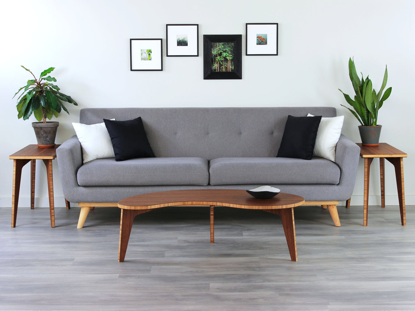 Kidney table in bamboo with a chestnut color finish, featuring a Japandi style design, set on a grey floor with a white background. Set in a living room area, a grey couch and side tables with houseplants. A small black pottery vessel is placed on the table top. 

mid century modern low table
midcentury modern coffee table
floor table
japan coffee table
japan furniture
japan table
kidney coffee table 
bamboo low table