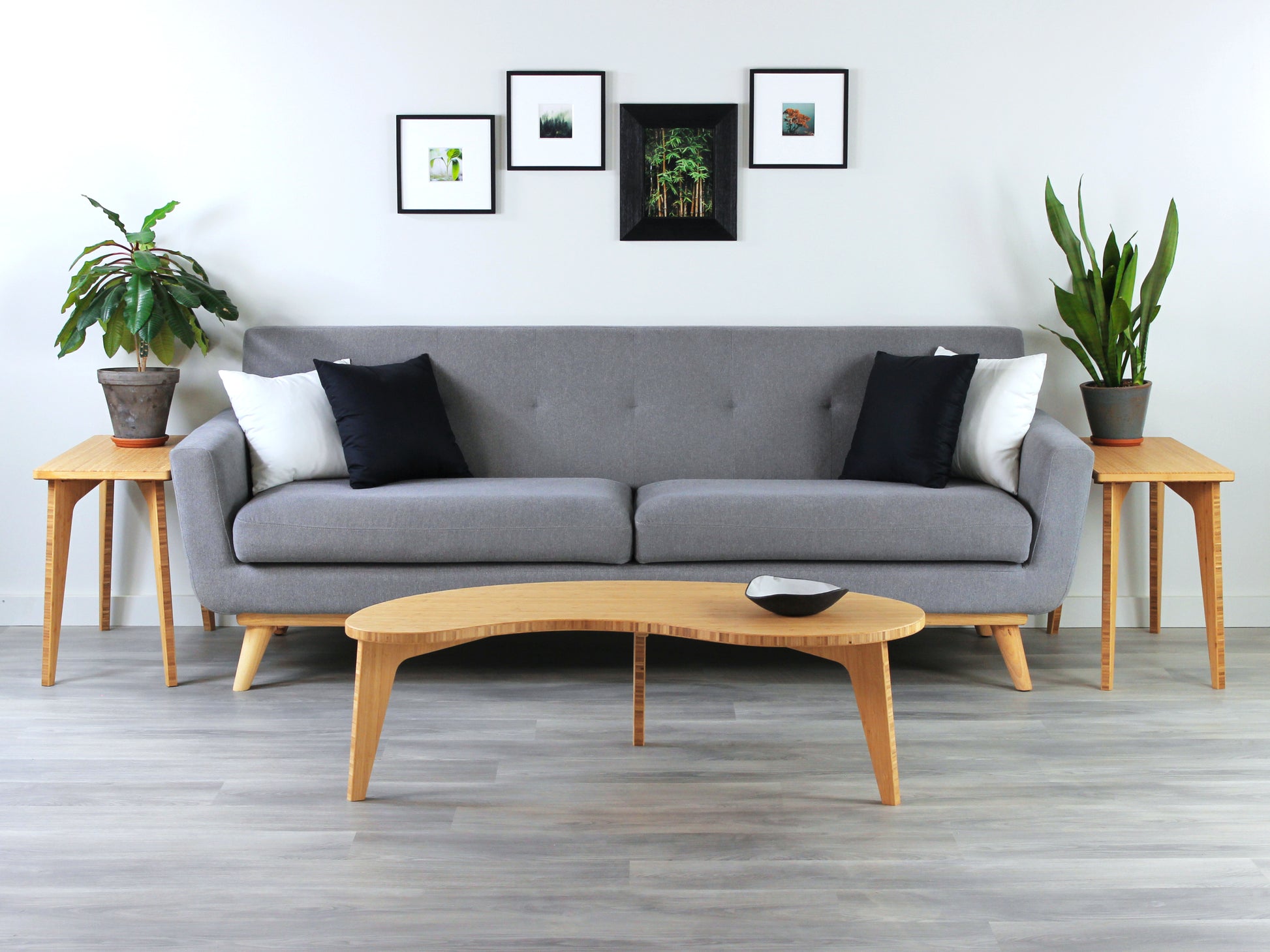 Kidney table in bamboo with a natural finish, featuring a Japandi style design, set on a grey floor with a white background. Set in a living room area, a grey couch and side tables with houseplants. A small black pottery vessel is placed on the table top. 

mid century modern low table
midcentury modern coffee table
floor table
japan coffee table
japan furniture
japan table
kidney coffee table 
bamboo low table