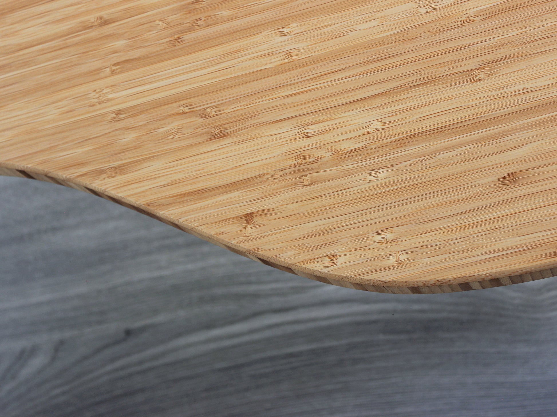 A kidney-shaped natural bamboo table, overhead view. Grey flooring with a white background. 

mid century modern low table
midcentury modern coffee table
floor table
japan coffee table
japan furniture
japan table
kidney coffee table 
bamboo low table