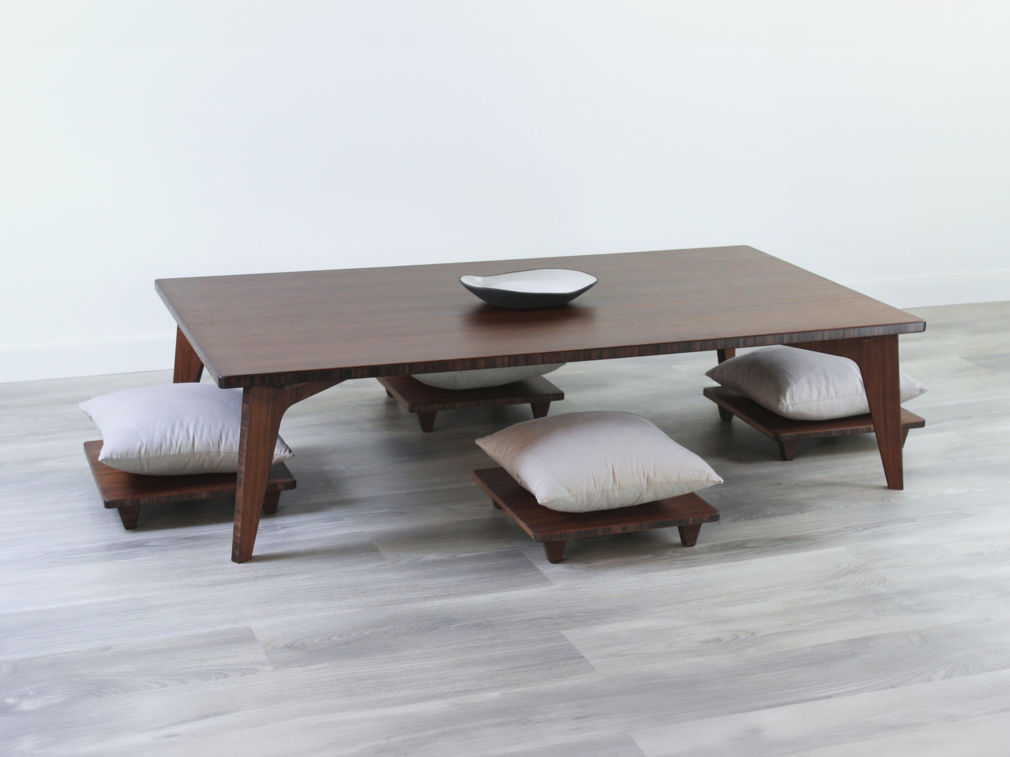 Large Rectangle Table Set - Walnut. Set on a grey floor, against a white background. Four Floor Chair Posture set underneath. A black pottery vessel on table top.

low table, coffee table, dining table, floor desk, floor chair, floor seating, low dining table, chabudai, tatami, kotatsu, minimalist, minimalist table,
modern, japanese low table, japanese table, kotatsu, large coffee table,
large dining table