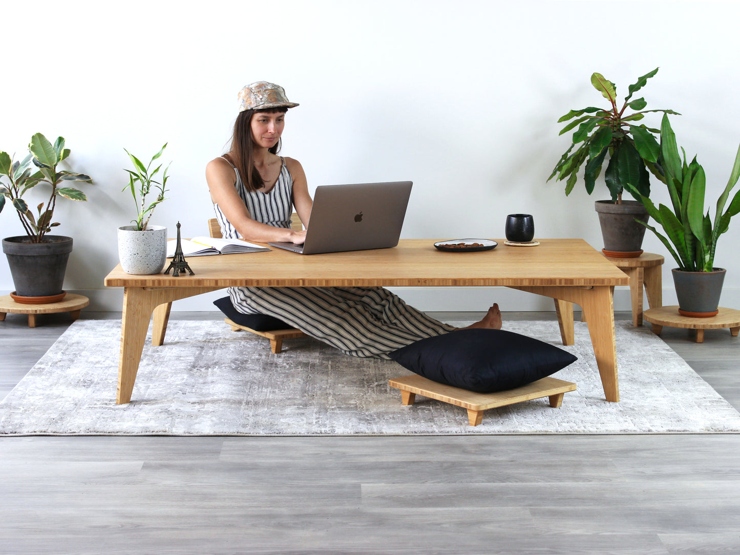 Large Rectangle Table Set - Natural. Set on a grey floor, against a white background. Office setting, a person working at a laptop with plant and a coffee cup on table.

low table, coffee table, dining table, floor desk, floor chair, floor seating, low dining table, chabudai, tatami, kotatsu, minimalist, minimalist table,
modern, japanese low table, japanese table, kotatsu, large coffee table,
large dining table
