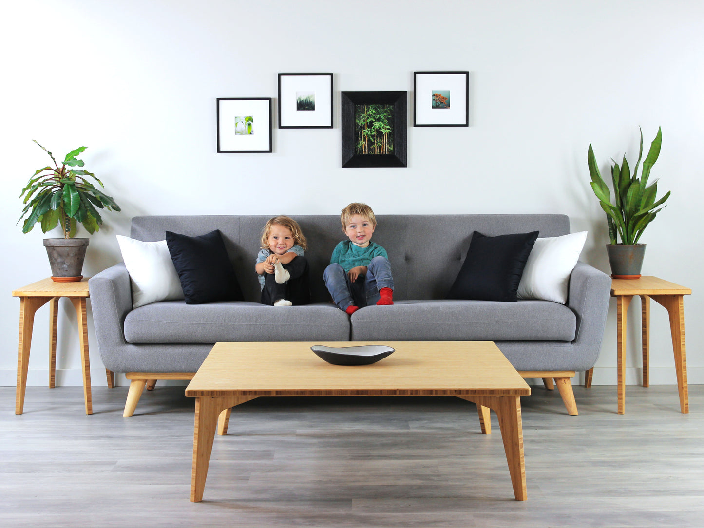 Large square floor table in bamboo with a chestnut color finish, featuring a Japandi style design, set on a grey floor with a white background. Set in a living room area, a grey couch and side tables with houseplants. A small black pottery vessel is placed on the table top. 


Square low table 
japanese furniture
japanese low table
low coffee table
low dining table
low table
mid century
minimalist
minimalist table
modern
chabudai