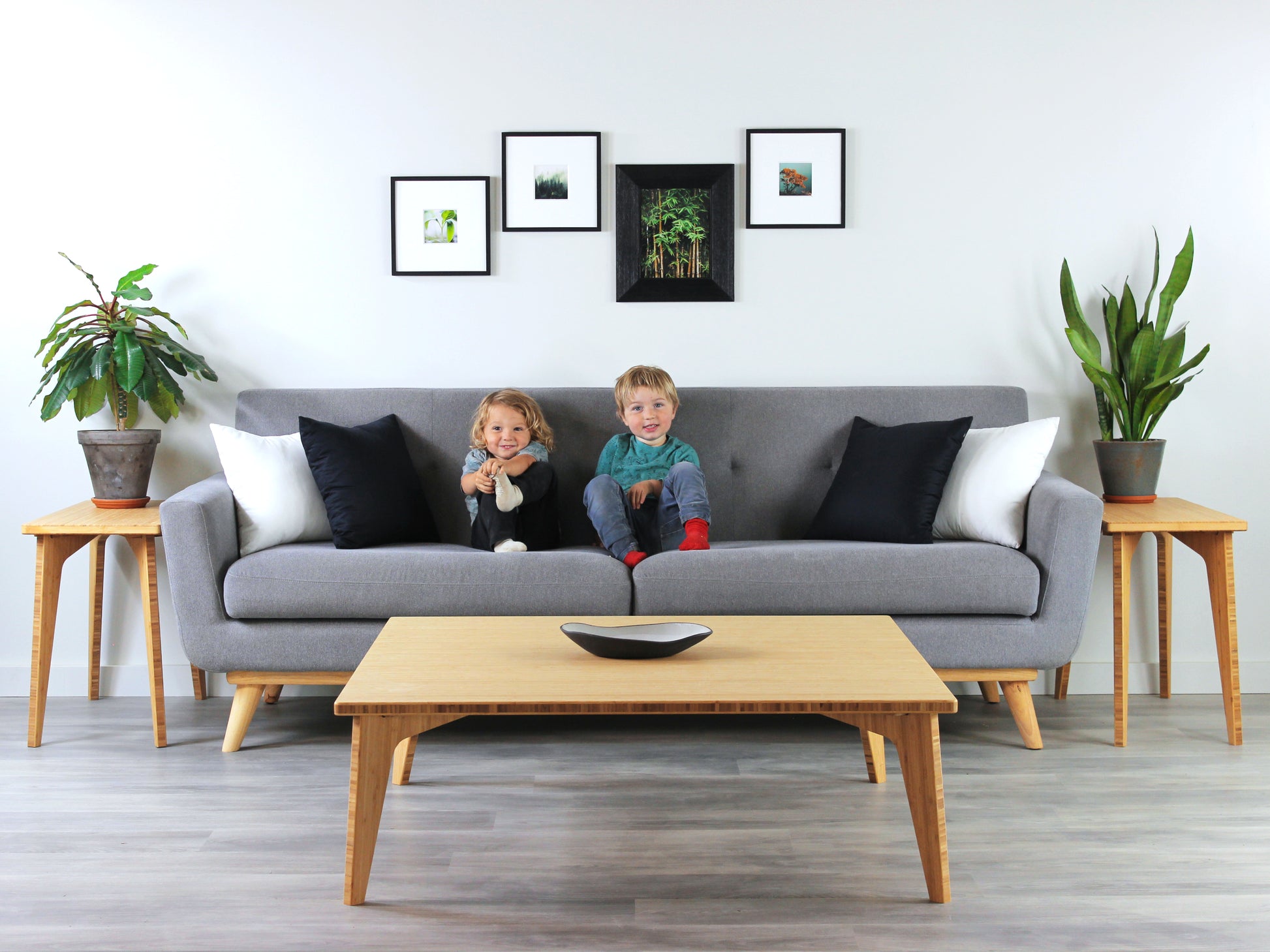 Large square floor table in bamboo with a chestnut color finish, featuring a Japandi style design, set on a grey floor with a white background. Set in a living room area, a grey couch and side tables with houseplants. A small black pottery vessel is placed on the table top. 


Square low table 
japanese furniture
japanese low table
low coffee table
low dining table
low table
mid century
minimalist
minimalist table
modern
chabudai