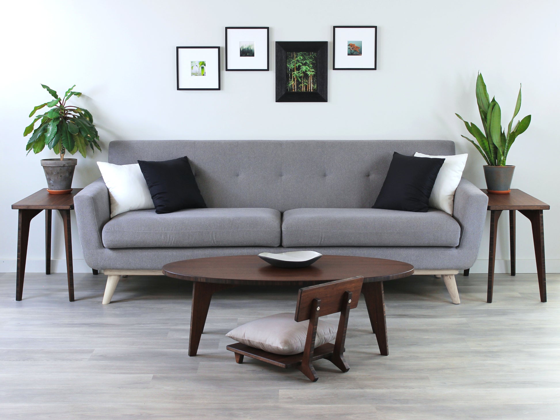 Oval LOW Table set with a walnut bamboo finish and midcentury modern design. A Floor Chair Comfort with grey pillow are set at the table. Small black pottery vessel placed on table top. 

Japandi, minimalist, mid-century, Japanese inspired, modern, contemporary, clean lines, organic design, sustainable bamboo, renewable bamboo, solid bamboo, eco-friendly furniture, natural materials, natural-based finish