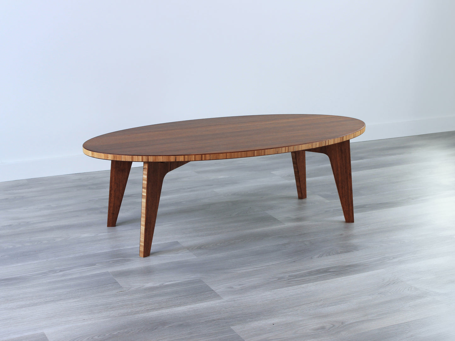 Oval bamboo table with a chestnut color finish, featuring a Japandi style design, set on a grey floor with a white background.

mid century modern low table
midcentury modern coffee table
floor table
japan coffee table
japan furniture
japan table
bamboo low table