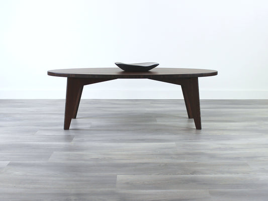 Oval bamboo table with a walnut color finish, featuring a Japandi style design, set on a grey floor with a white background. A small black pottery vessel is placed on the table top. 

mid century modern low table
midcentury modern coffee table
floor table
japan coffee table
japan furniture
japan table
bamboo low table