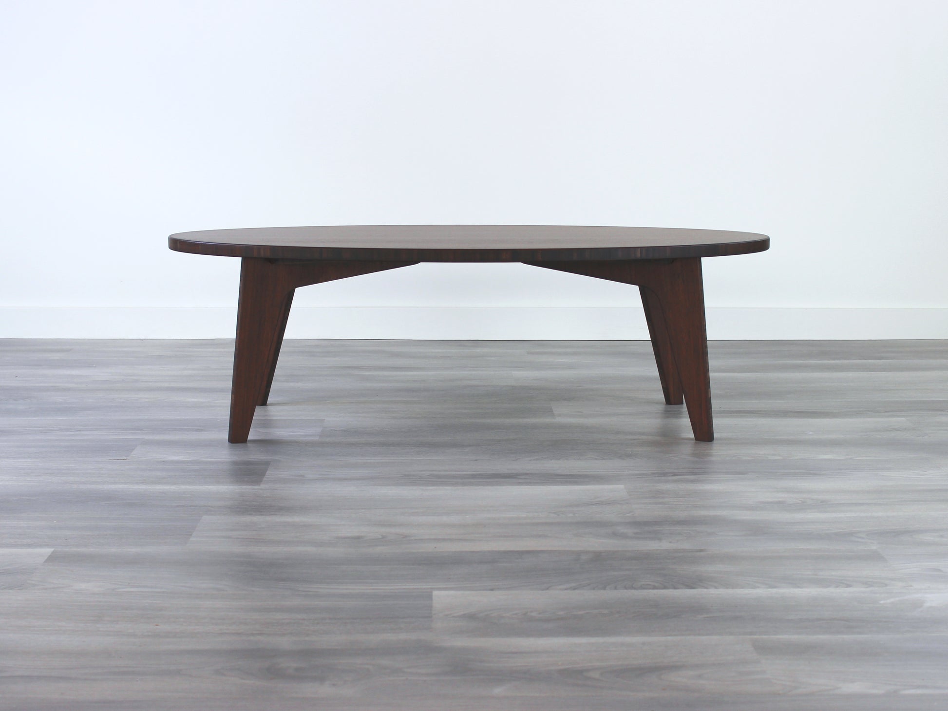 Oval bamboo table with a walnut color finish, featuring a Japandi style design, set on a grey floor with a white background.

mid century modern low table
midcentury modern coffee table
floor table
japan coffee table
japan furniture
japan table
oval coffee table 
bamboo low table