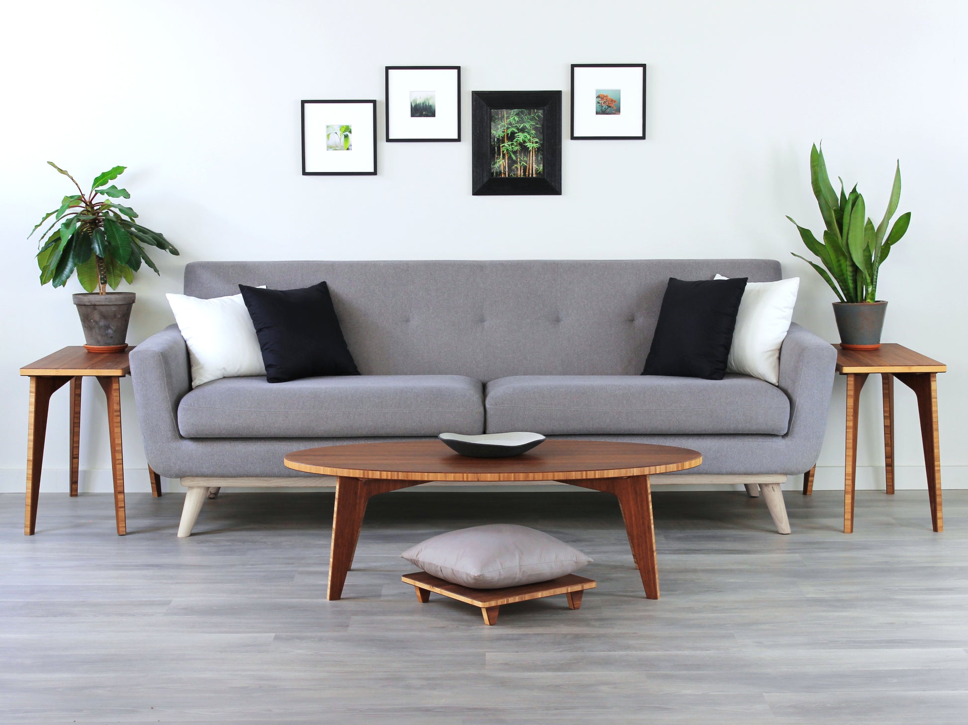 Two rectangular side tables with a chestnut finish bamboo top and legs, placed on a grey floor, with a white background. Set in a living room with grey couch, circle low table and floor chair. 
mid century
minimalist
chabudai
coffee table
side table
living room 
end tables 