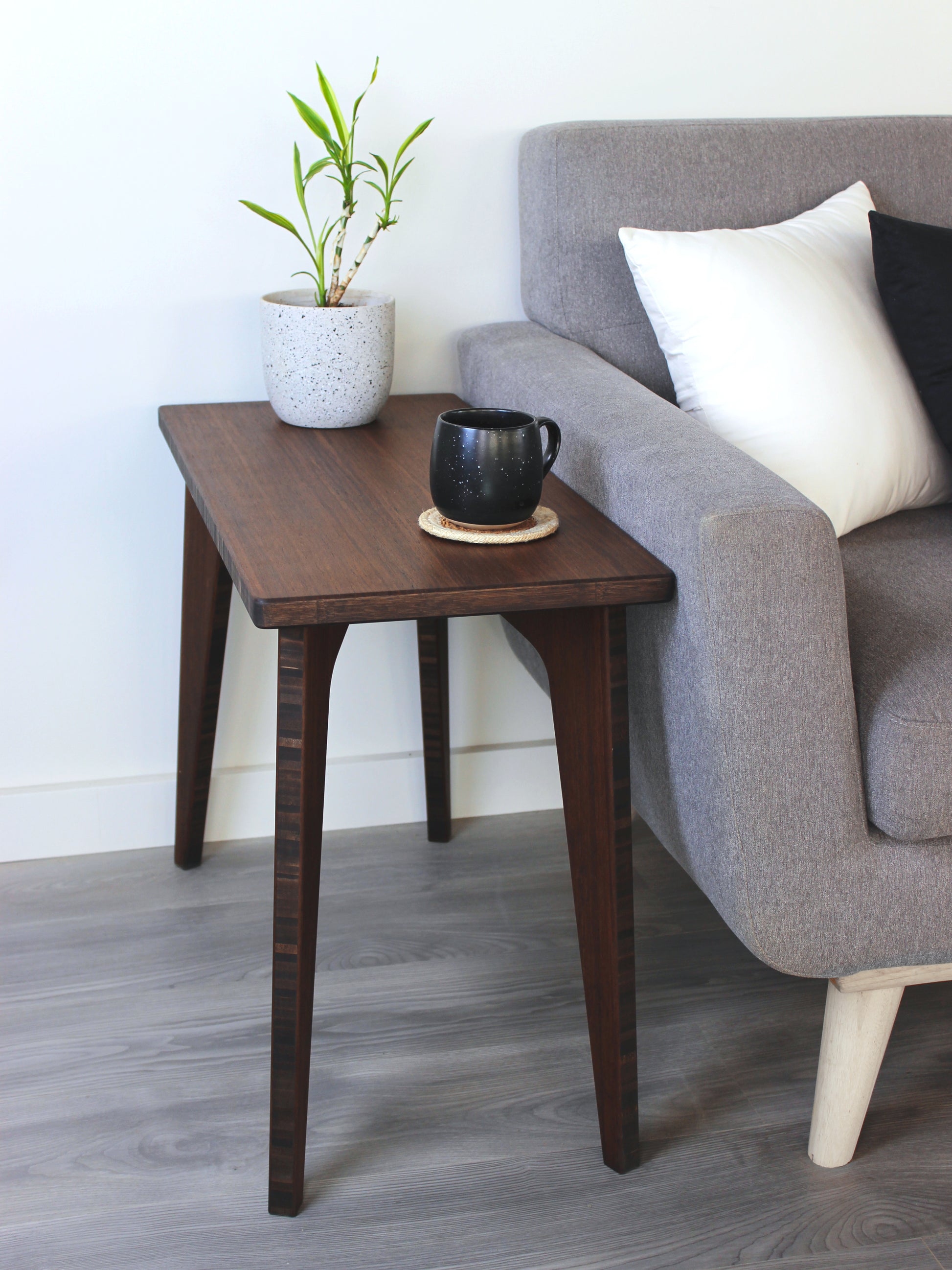 side table 
tatami
minimalist table
couch table 
japanese table
kotatsu
plant and mug on side table next to couch