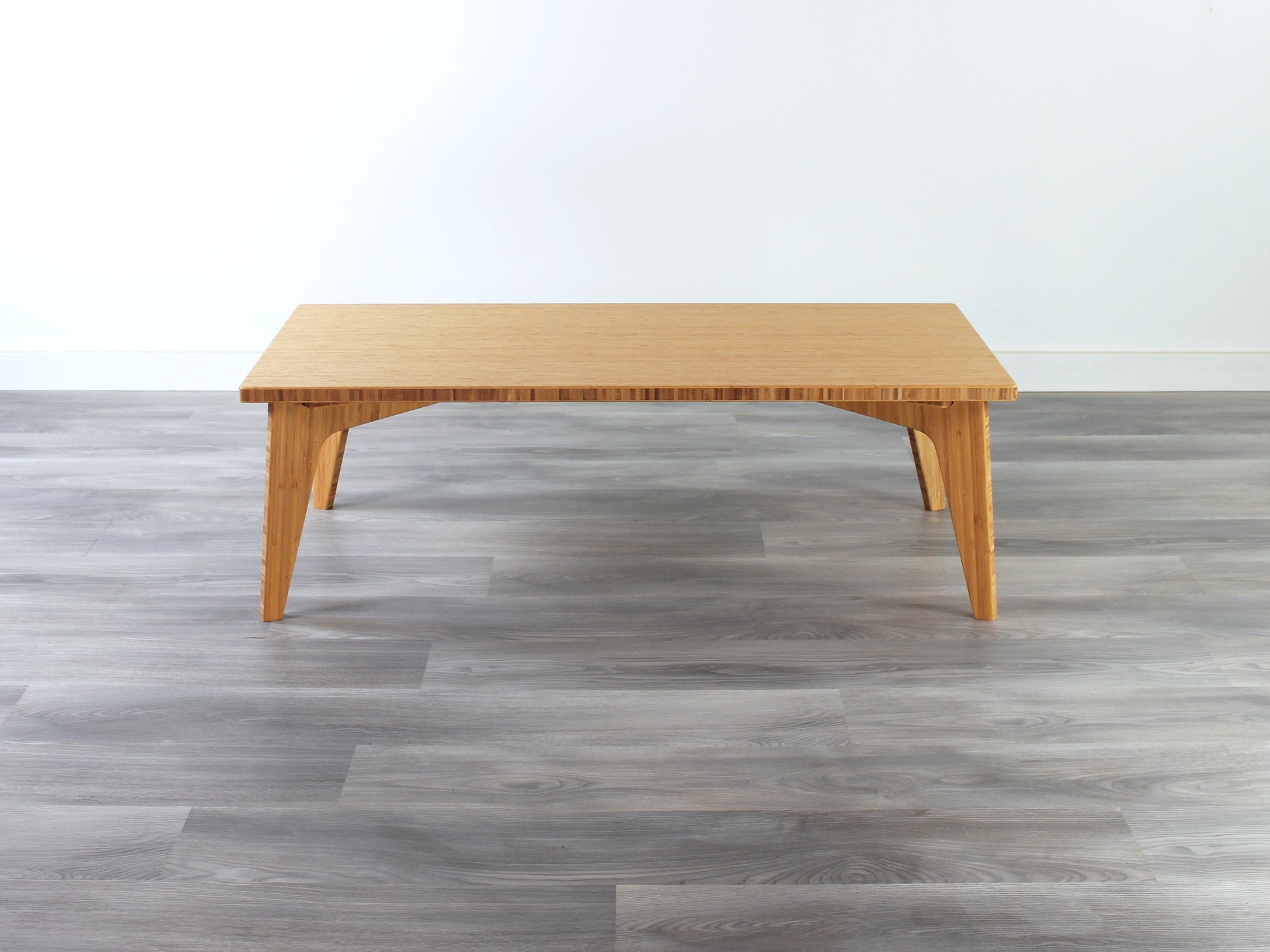 A rectangular low table made of bamboo with a natural finish, placed on a grey floor, designed for multi-functional use in living spaces.

japanese furniture
japanese low table
low coffee table
low dining table
low table
mid century
minimalist
minimalist table
modern
