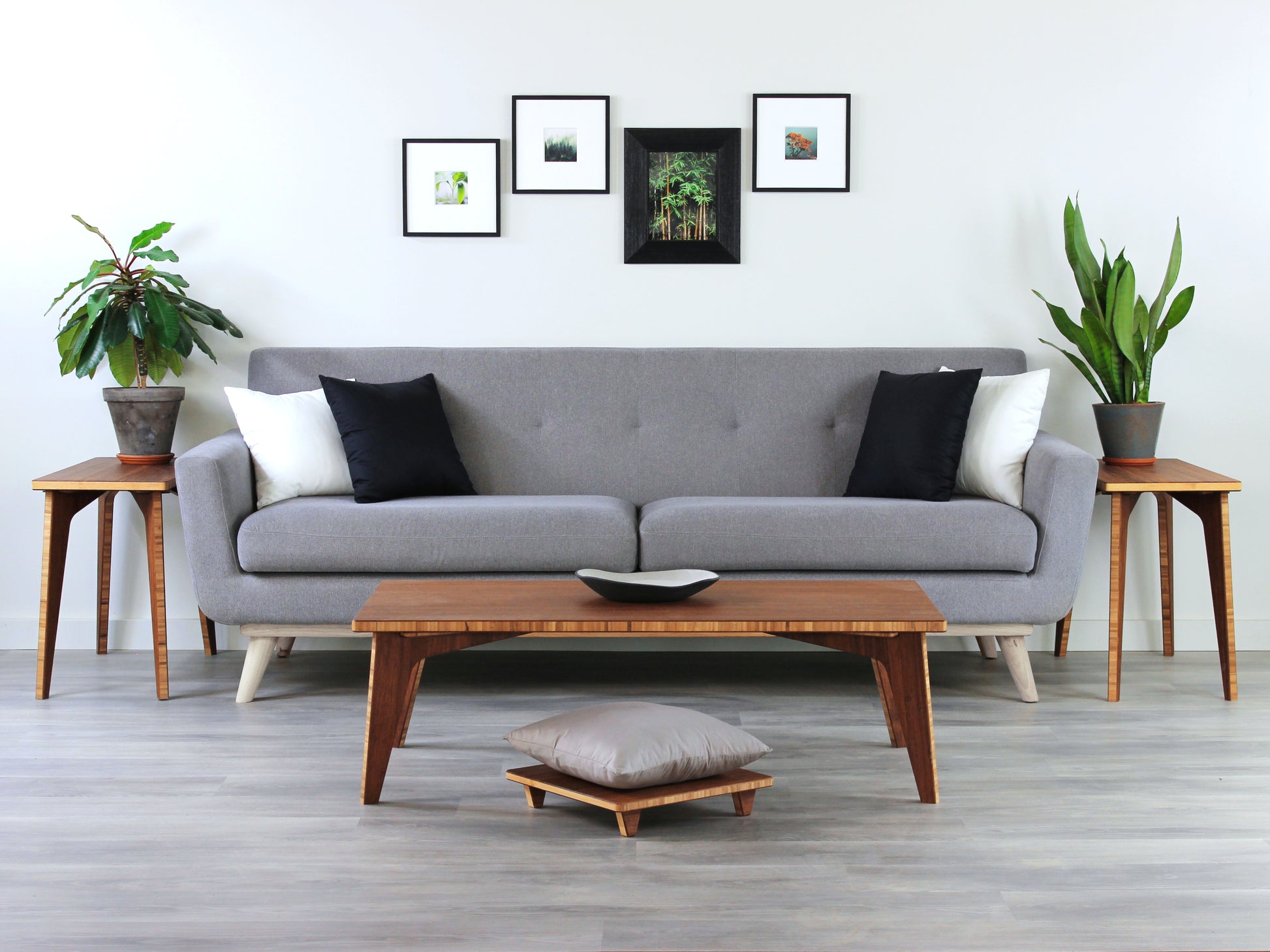 Small Rectangle Table Set- Chestnut, low table with Floor Chair Posture set under with grey pillow. Set on a grey floor, against a white background. A small black pottery vessel is on the table top. In a living room setting with a grey couch, and chestnut Side Tables with houseplants on top. 

low table, coffee table, dining table, floor desk, floor chair, floor seating, low dining table, chabudai, tatami, kotatsu, minimalist, minimalist table,
modern