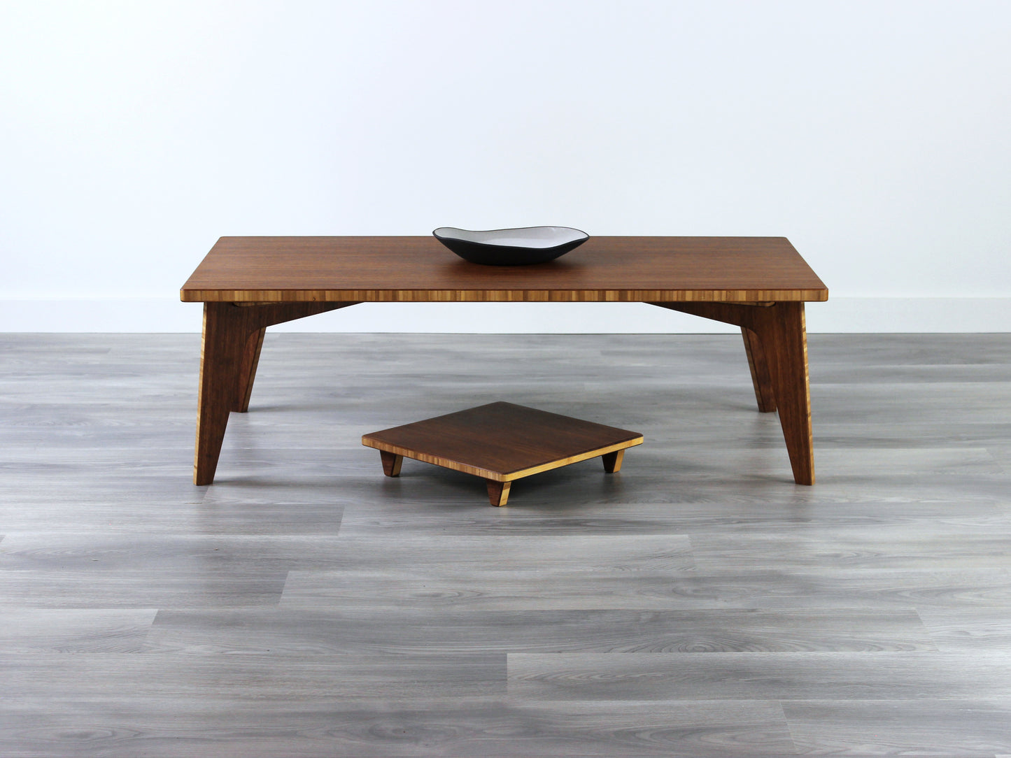 Small Rectangle Table Set - Chestnut, low table with Floor Chair Posture set underneath. Set on a grey floor, against a white background. A small black pottery vessel is on the table top. 

low table, coffee table, dining table, floor desk, floor chair, floor seating, low dining table, chabudai, tatami, kotatsu, minimalist, minimalist table,
modernn