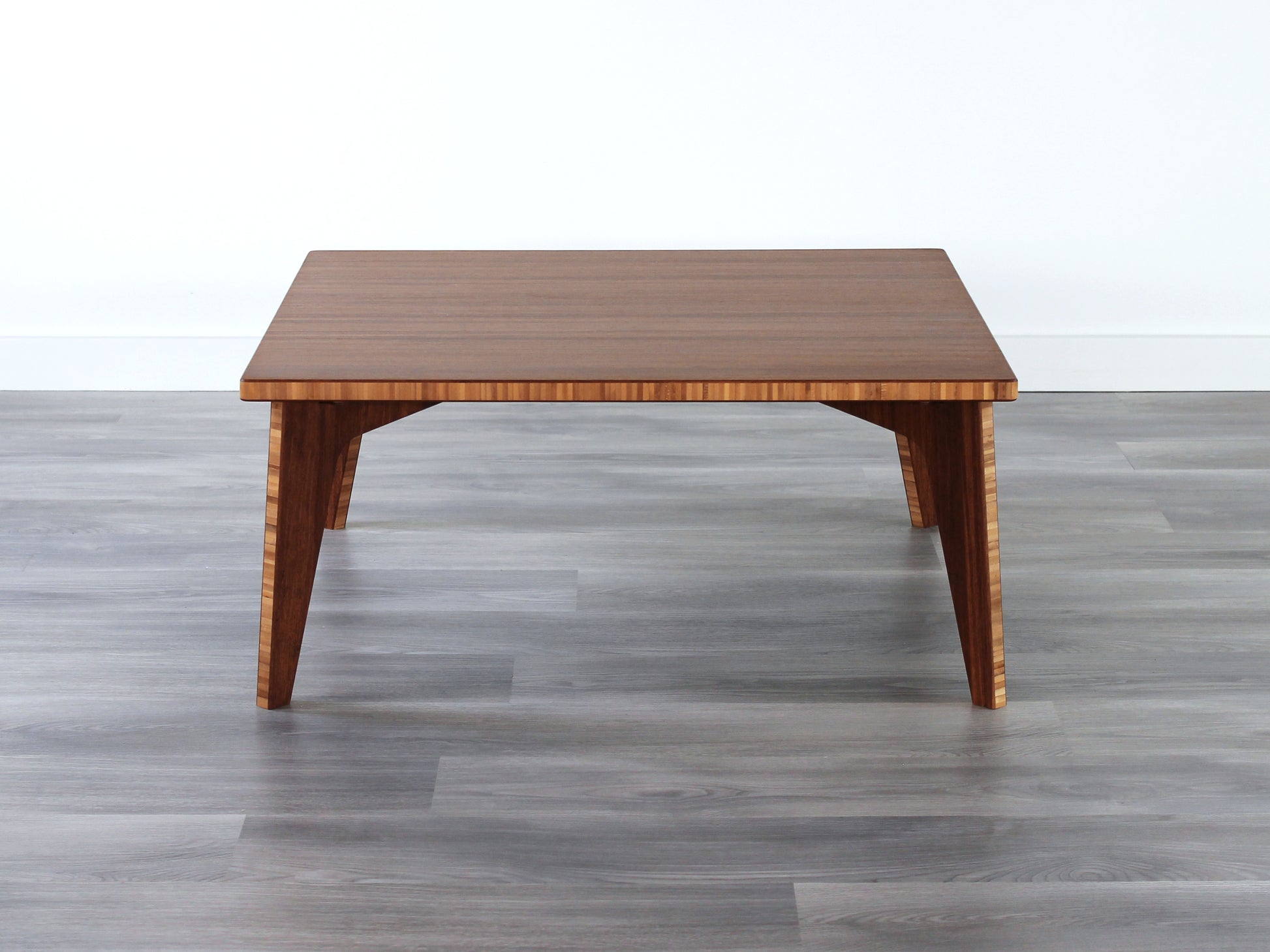 Small Square Table with chestnut bamboo finish. Grey flooring with a white background. 

mid century modern low table
midcentury modern coffee table
floor table
japan coffee table
japan furniture
japan table
small coffee table 
bamboo low table