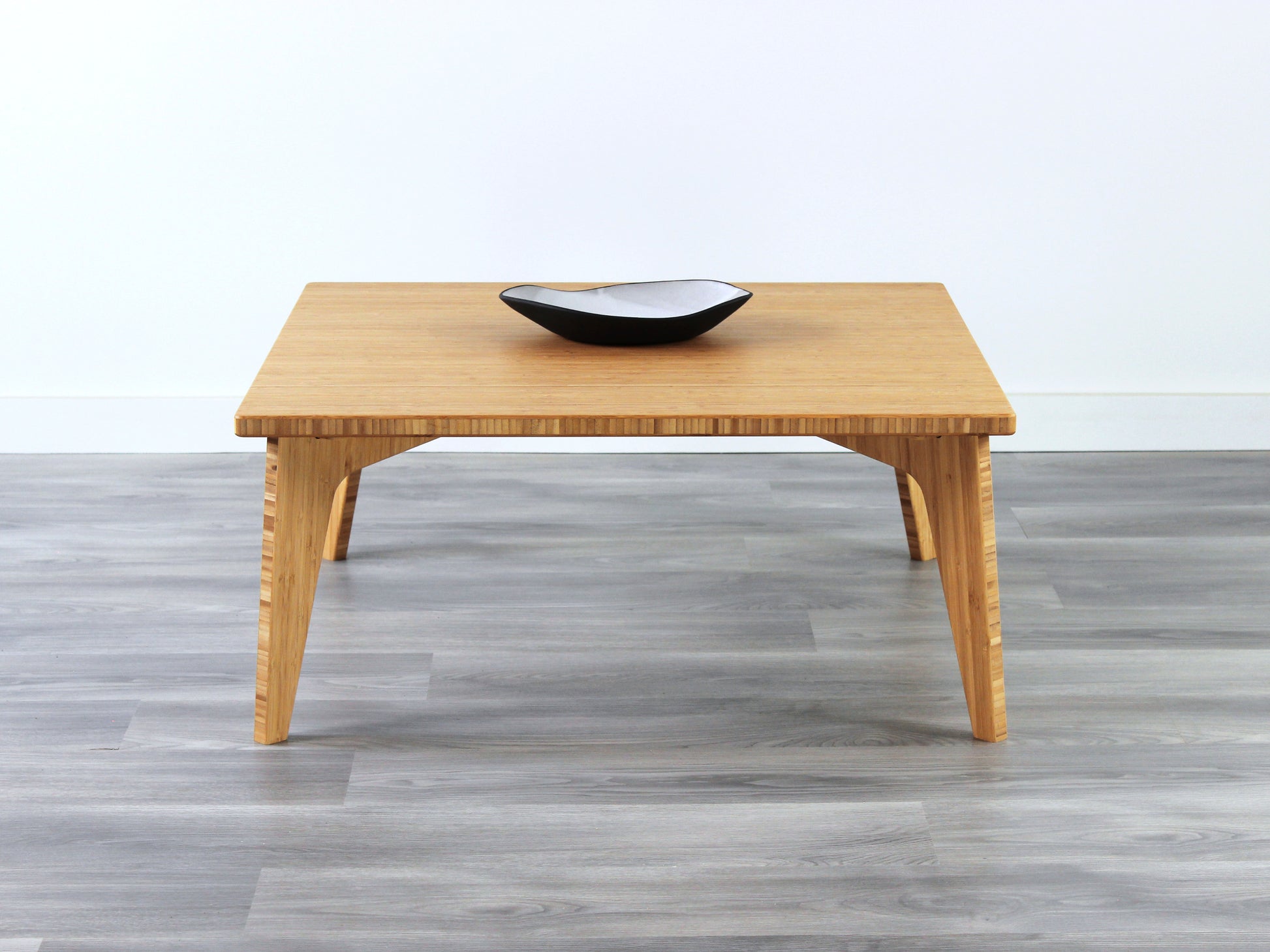Small Square Table with natural bamboo finish, featuring a small black and white pottery vessel placed on top. Grey flooring with a white background. 

mid century modern low table
midcentury modern coffee table
floor table
japan coffee table
japan furniture
japan table
small coffee table 
bamboo low table
