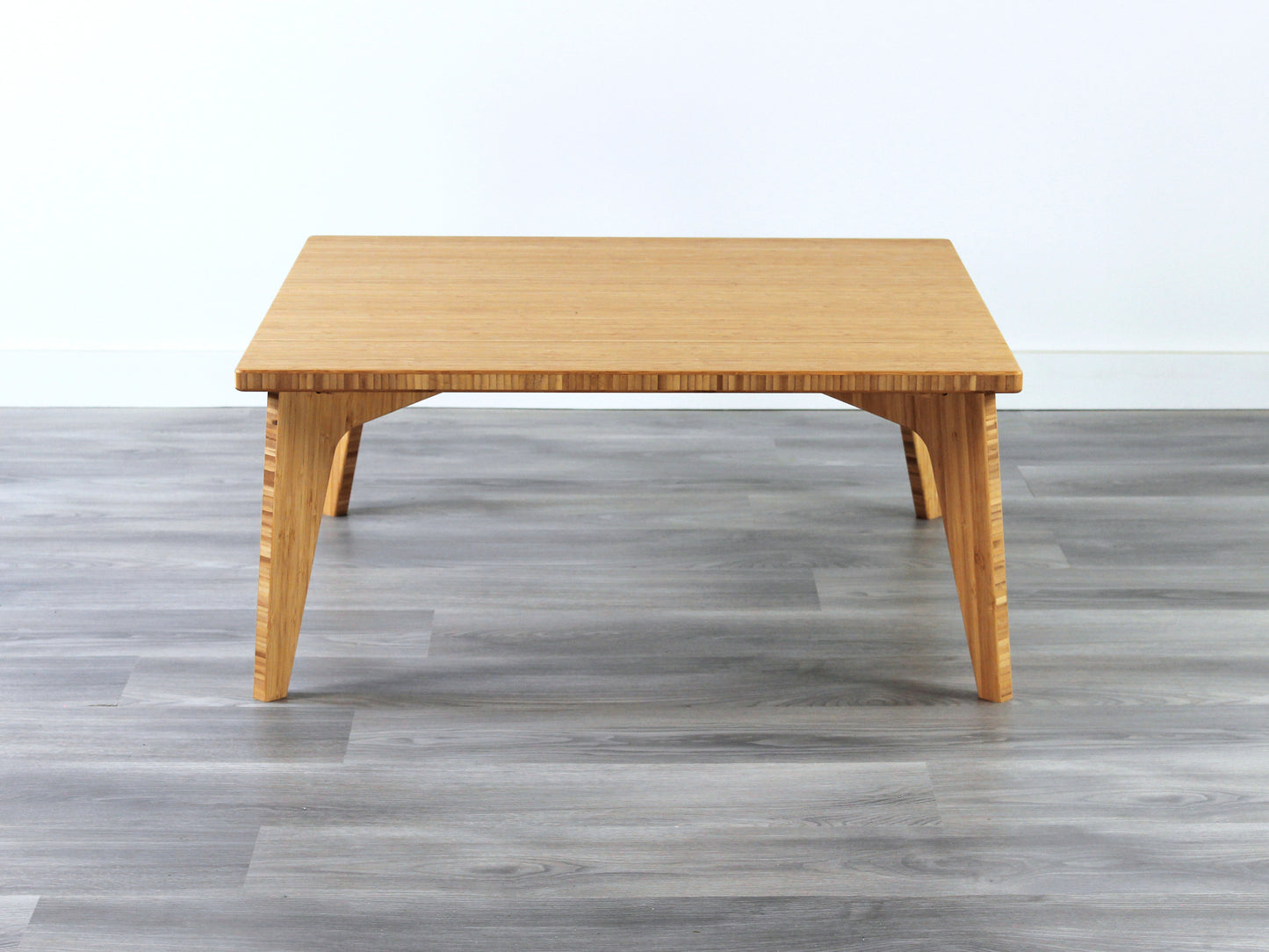 Small Square Table with natural bamboo finish. Grey flooring with a white background. 

mid century modern low table
midcentury modern coffee table
floor table
japan coffee table
japan furniture
japan table
small coffee table 
bamboo low table