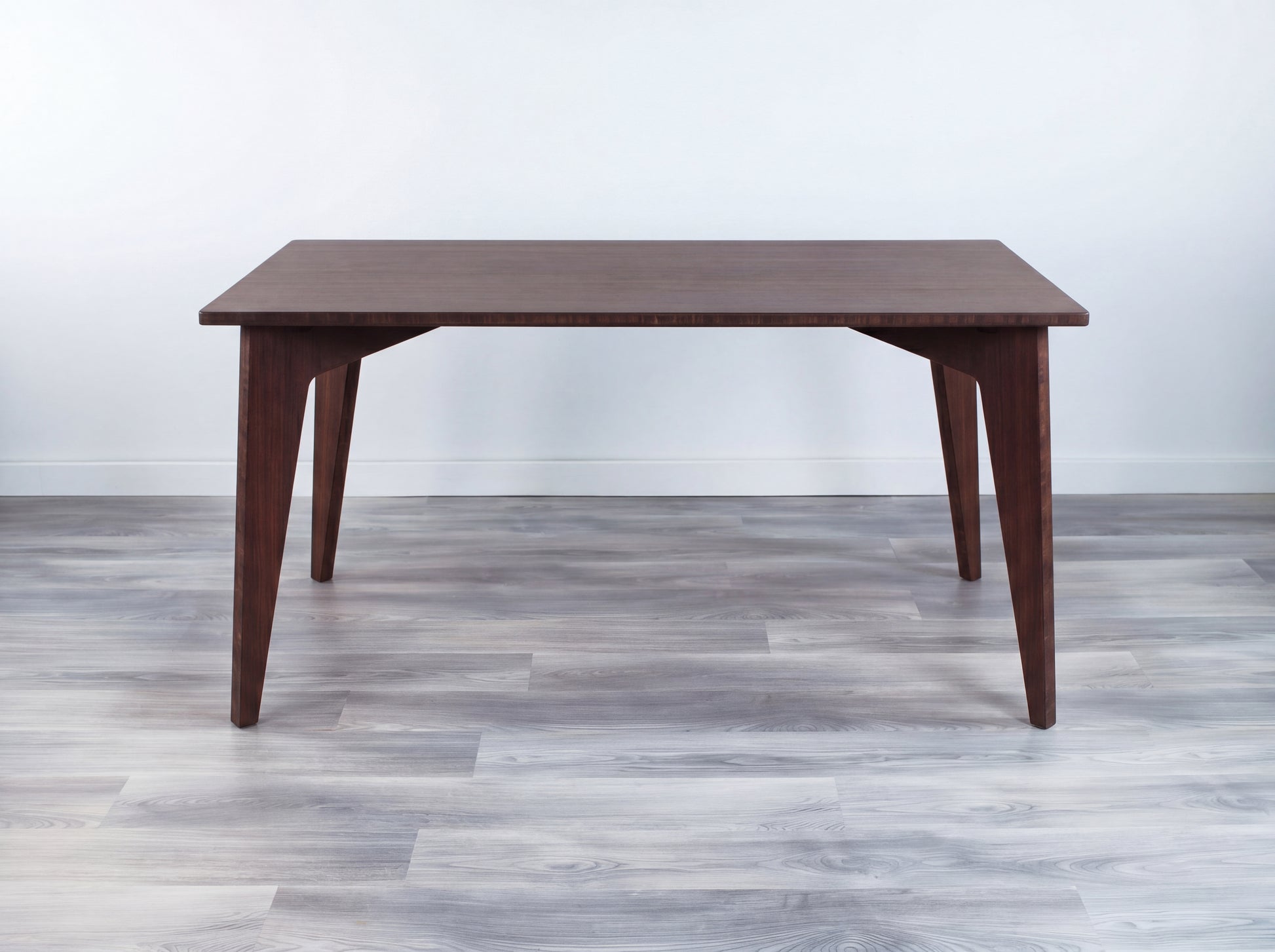 Walnut bamboo dining table on a white background