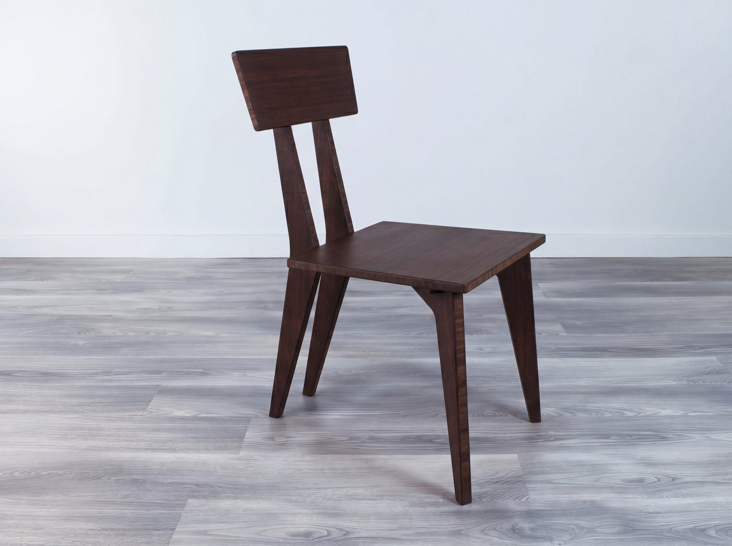 Bamboo walnut dining chair on gray floor with white wall background