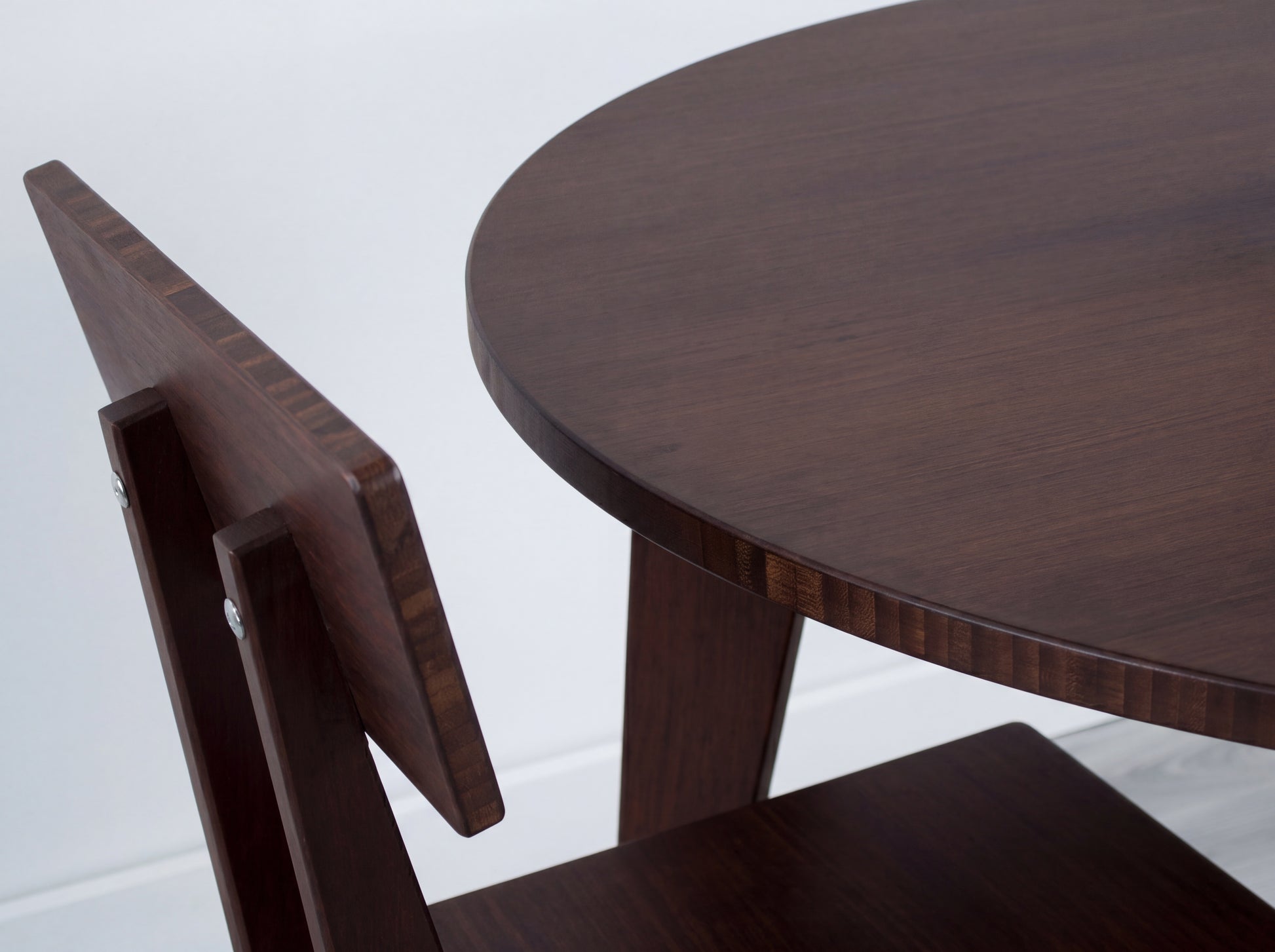 Dark bamboo table and chair set on a white background